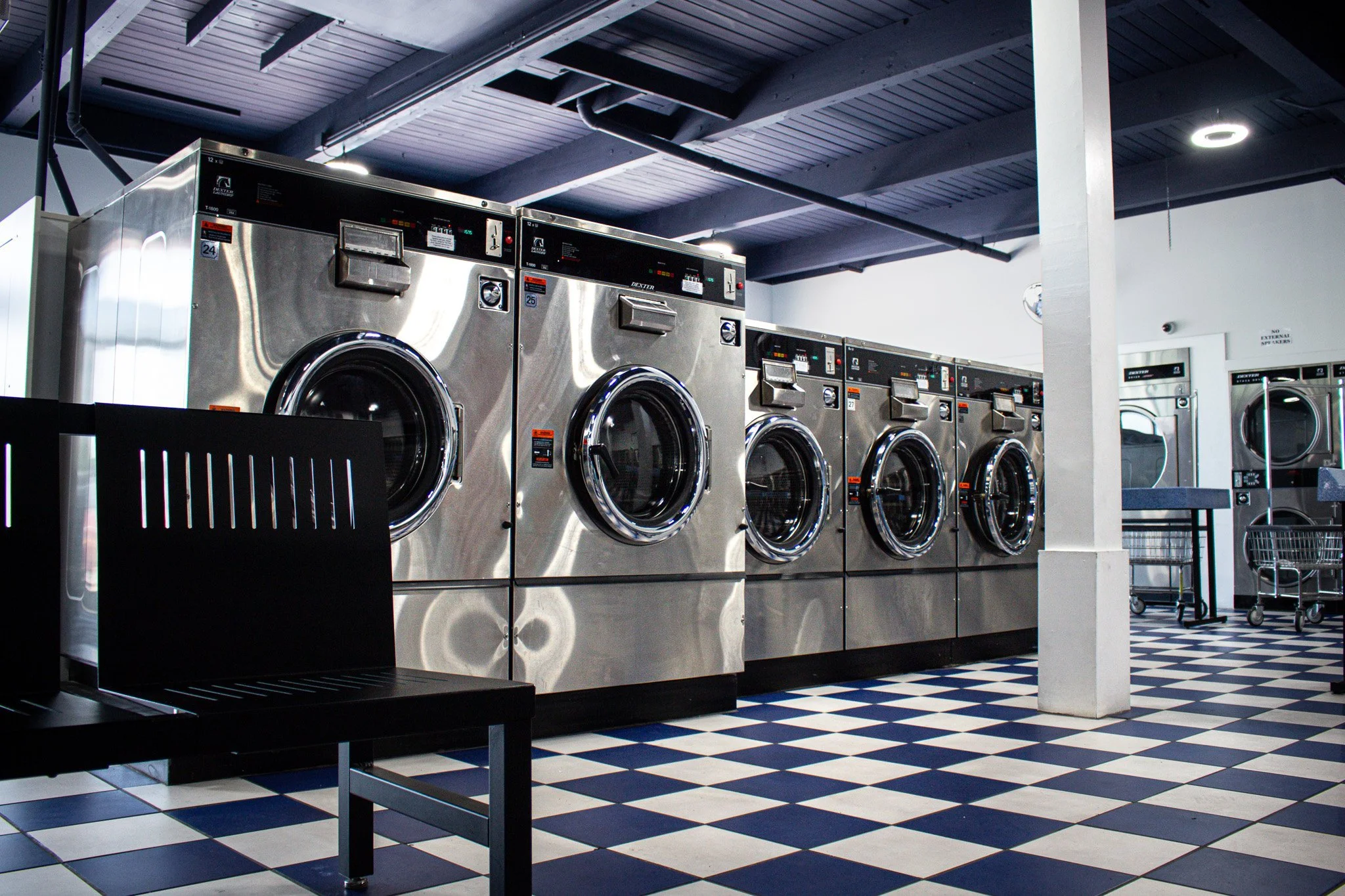 Modern Dexter washers and clean laundry facility at Grandview Coin Laundry in Grandview, Missouri