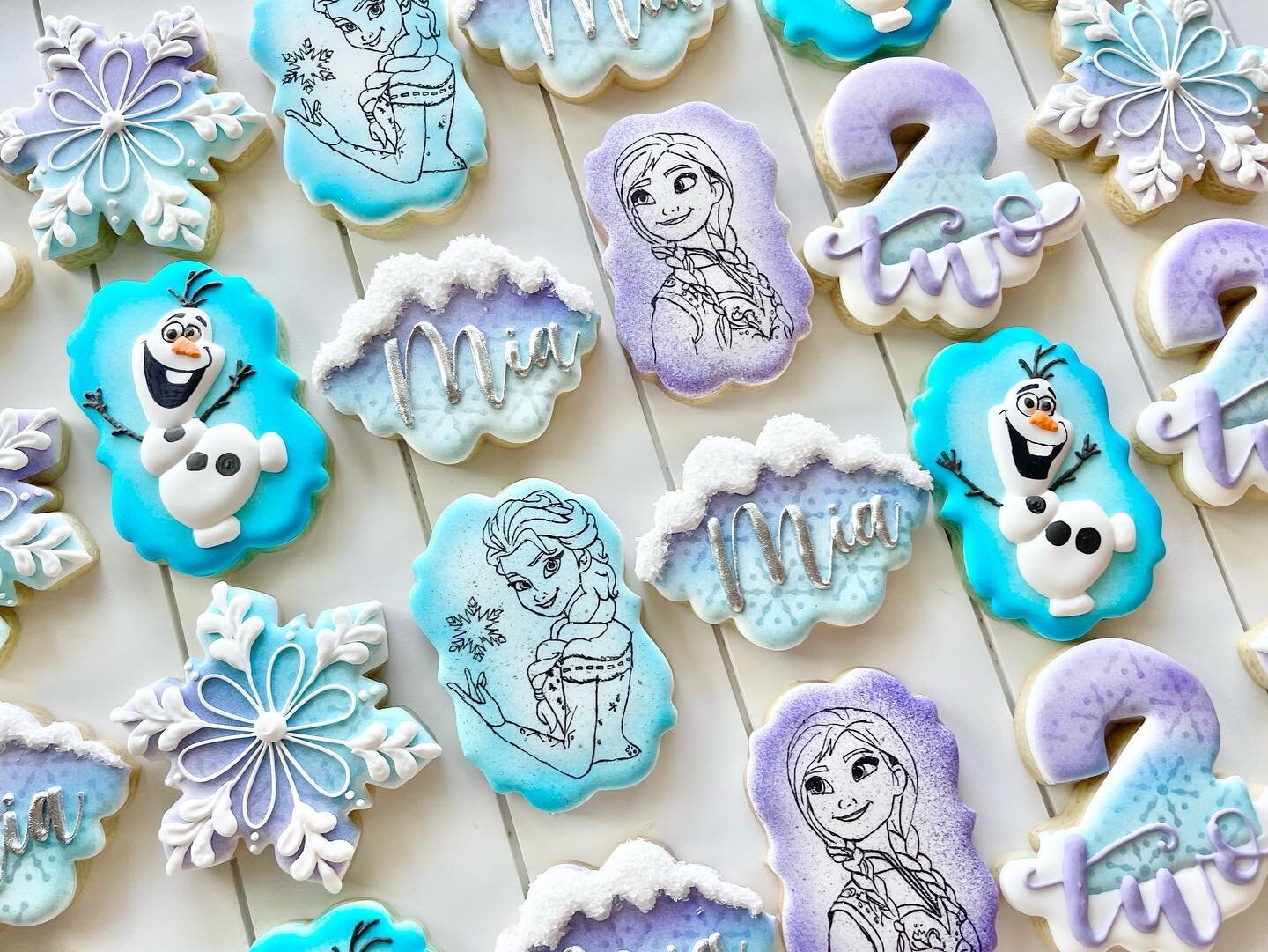 Frozen cookies in honor of this cooler weather we have had this week. ❄️ ⛄️ 
.
Happy Birthday Mia
.
.
.
.
#frozen #anna #elsa #olaf #snowflakes #frozencookies #annaandelsa #elsacookies #snowflakes #thecoldneverbotheredmeanyway #sugarcookies #tampa #t