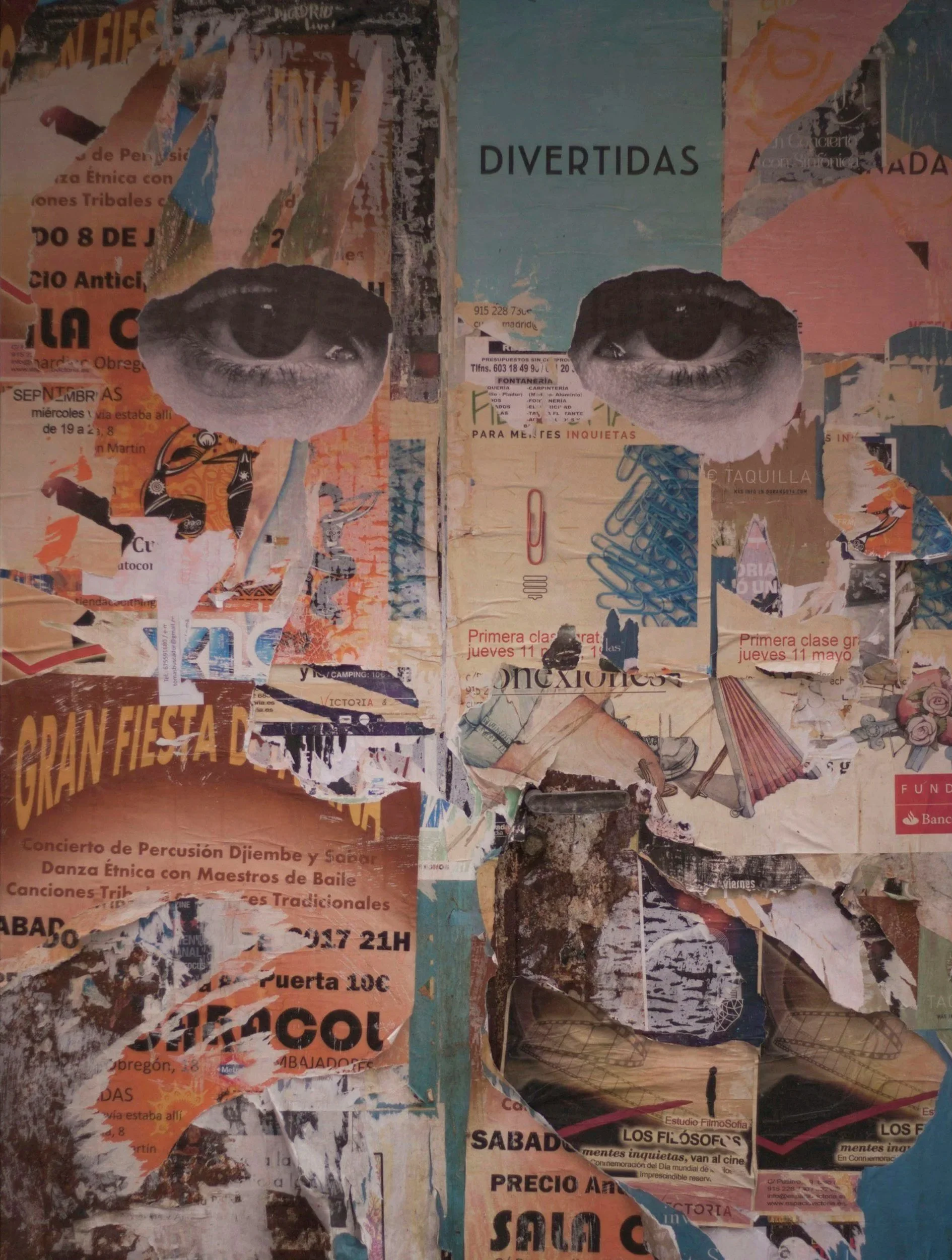 Collage of torn and overlapping posters and flyers, including two large black-and-white eyes, with text in Spanish advertising cultural and music events.