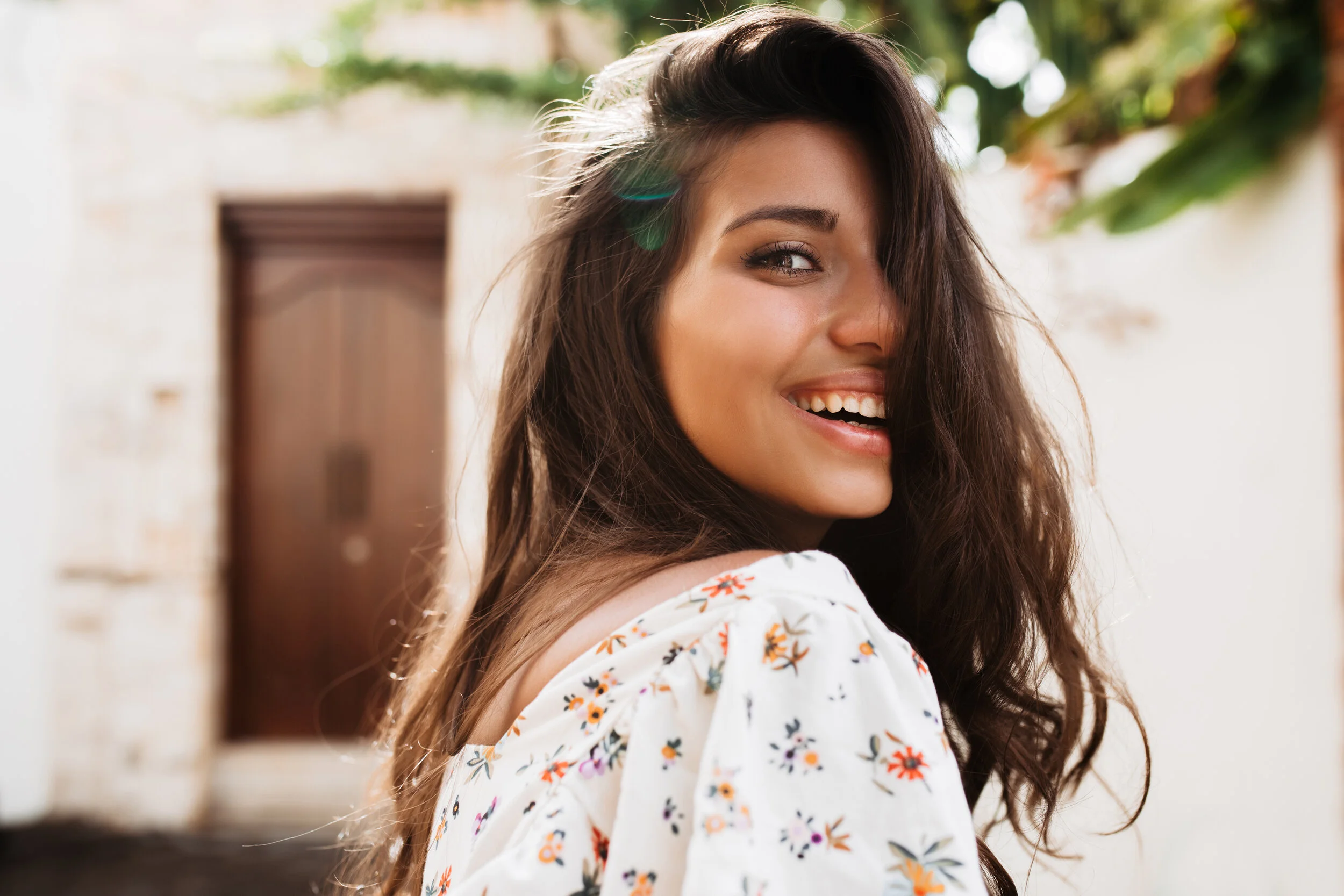 closeup-portrait-dark-haired-tanned-woman-with-long-eyelashes-posing-with-smile-street.jpg