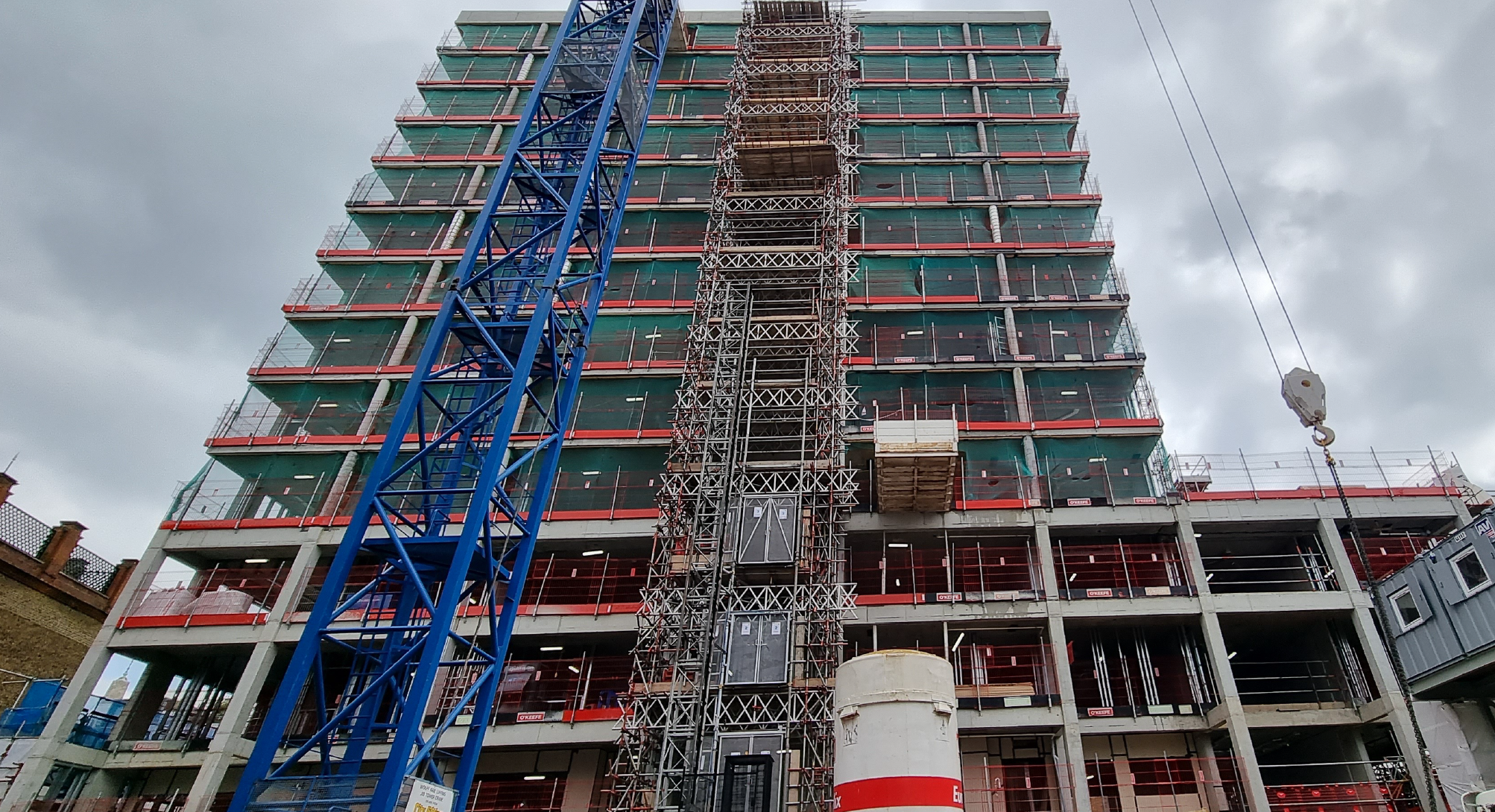 Reinforced concrete frame completed to level 14, including the roof parapet