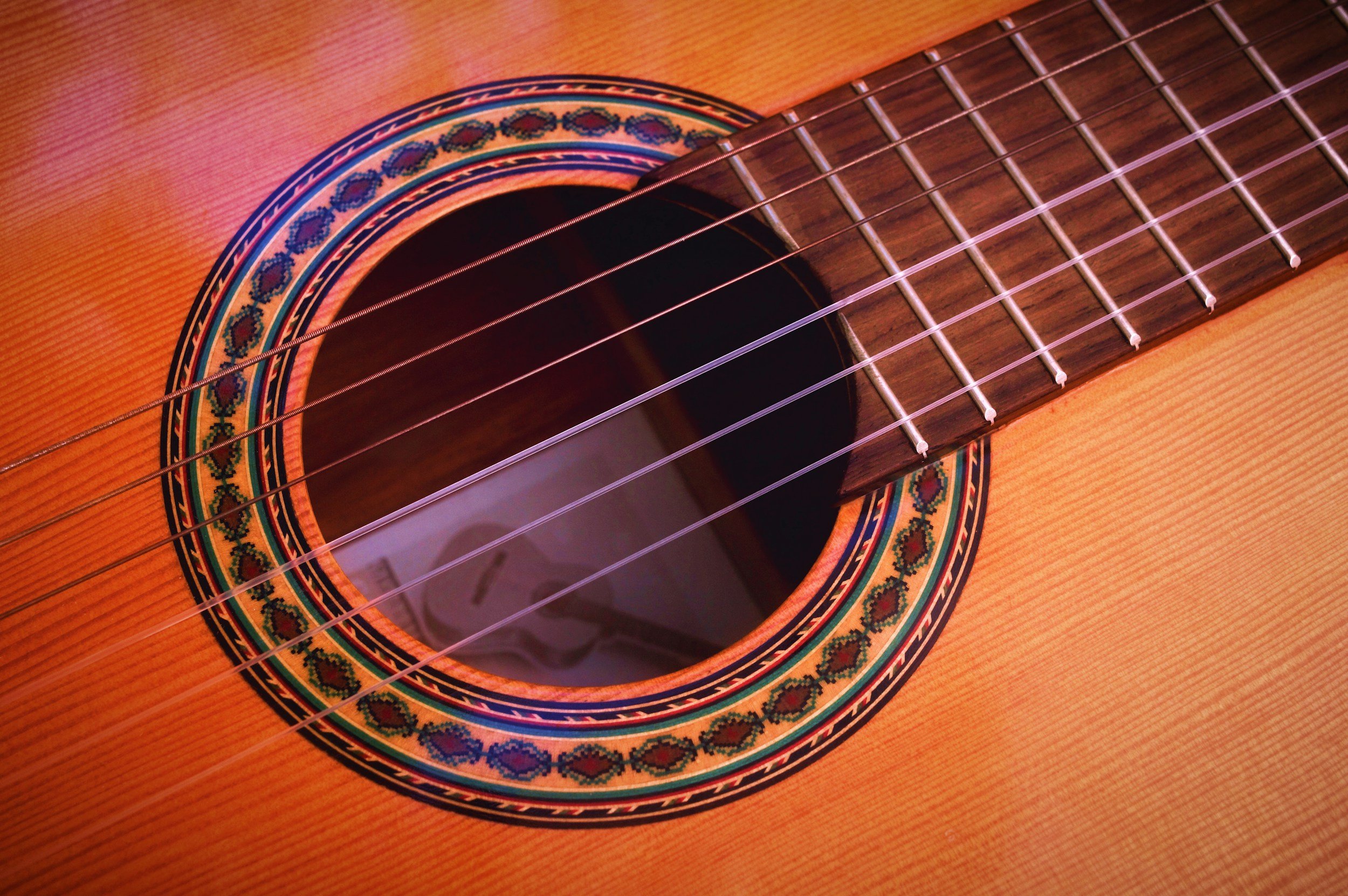 Close up of the soundhole on an acoustic guitar