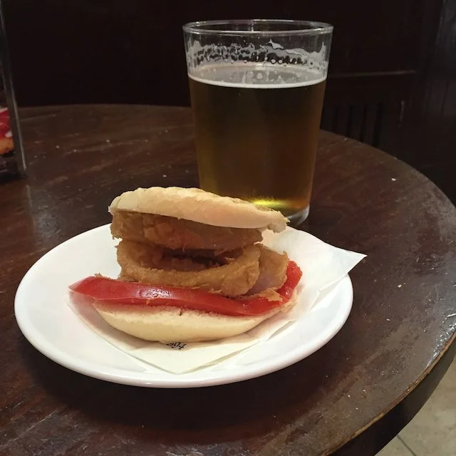 A typical Andalusian tapas with a glass of beer