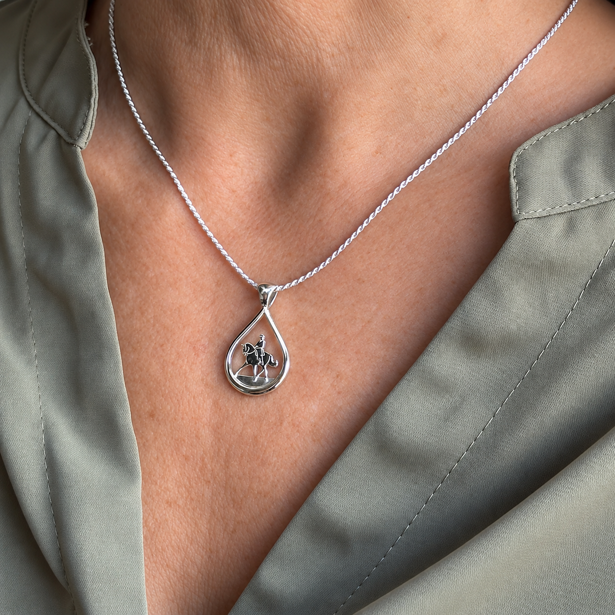 Silver Teardrop Dressage Pendant on model Sage Blouse.png