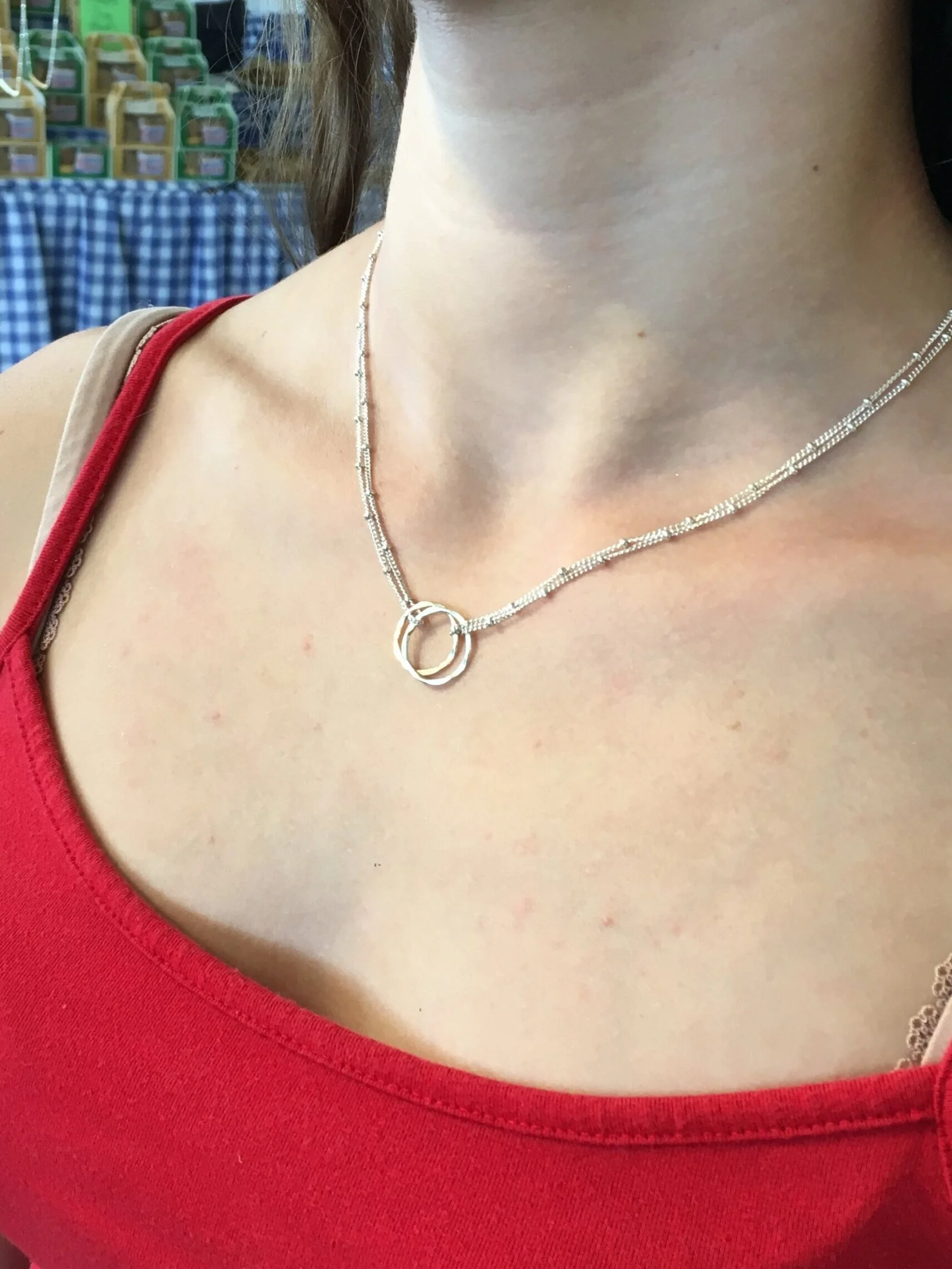 Interlaced Necklace worn on a person's neck