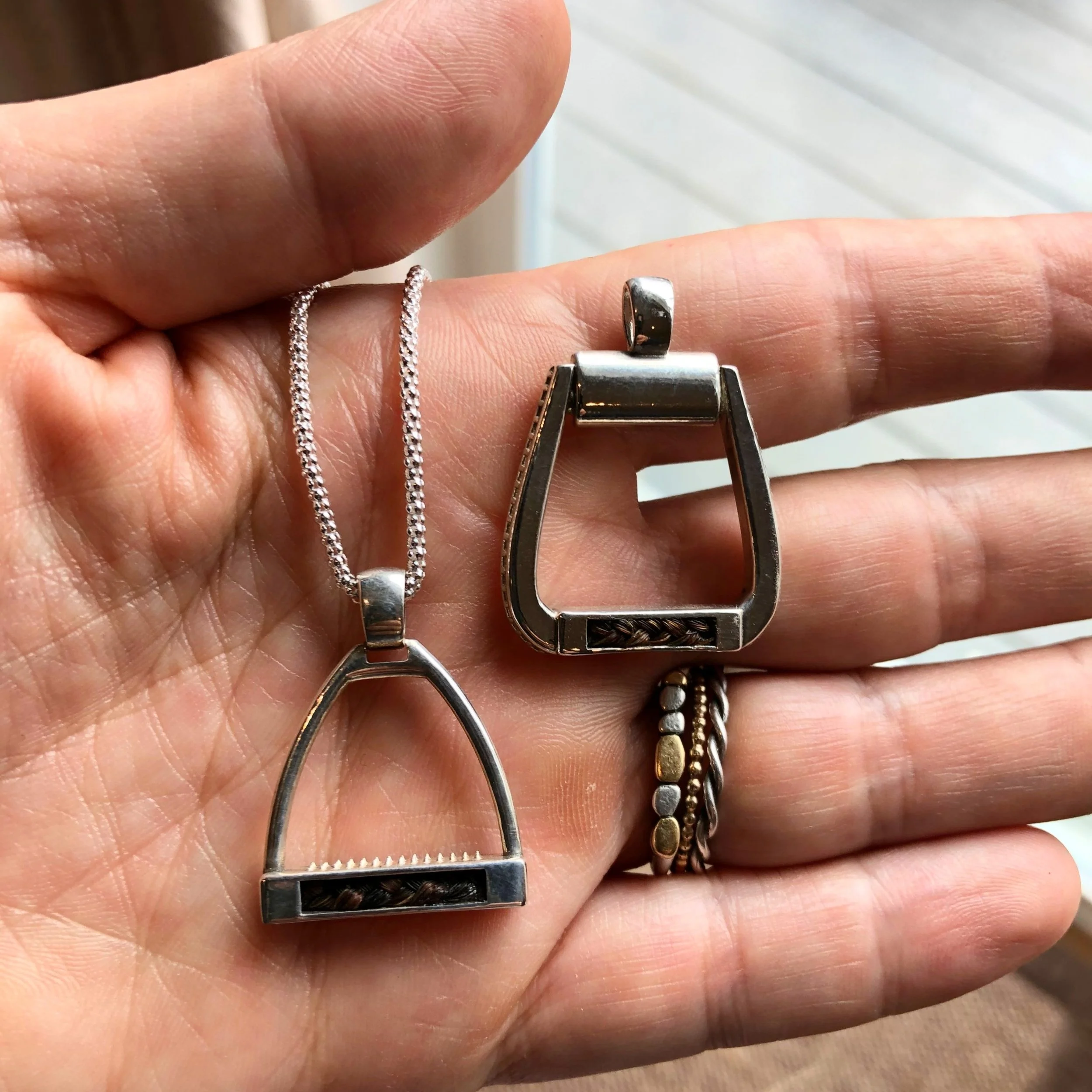 Inlaid Horse Hair English Iron resting in person's palm