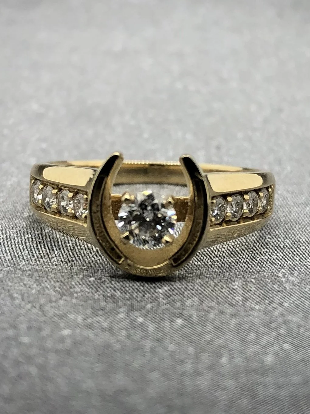 14kt rimshoe ring w: diamond dark background.jpeg
