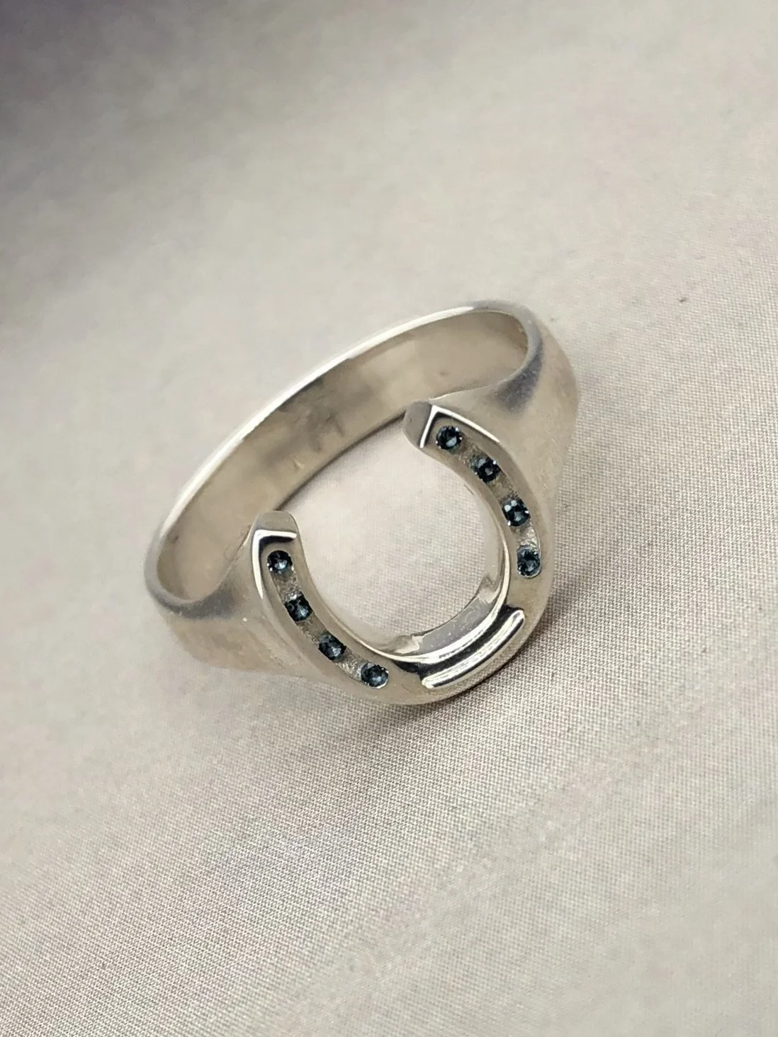 SS Hoseshoe signet ring w: blue topaz 2.jpeg