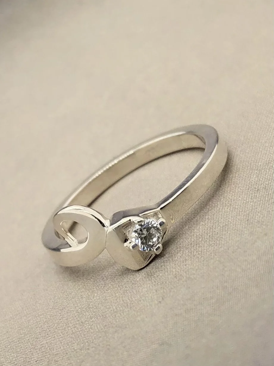 SS horseshoe nail ring w: single stone 2.jpeg