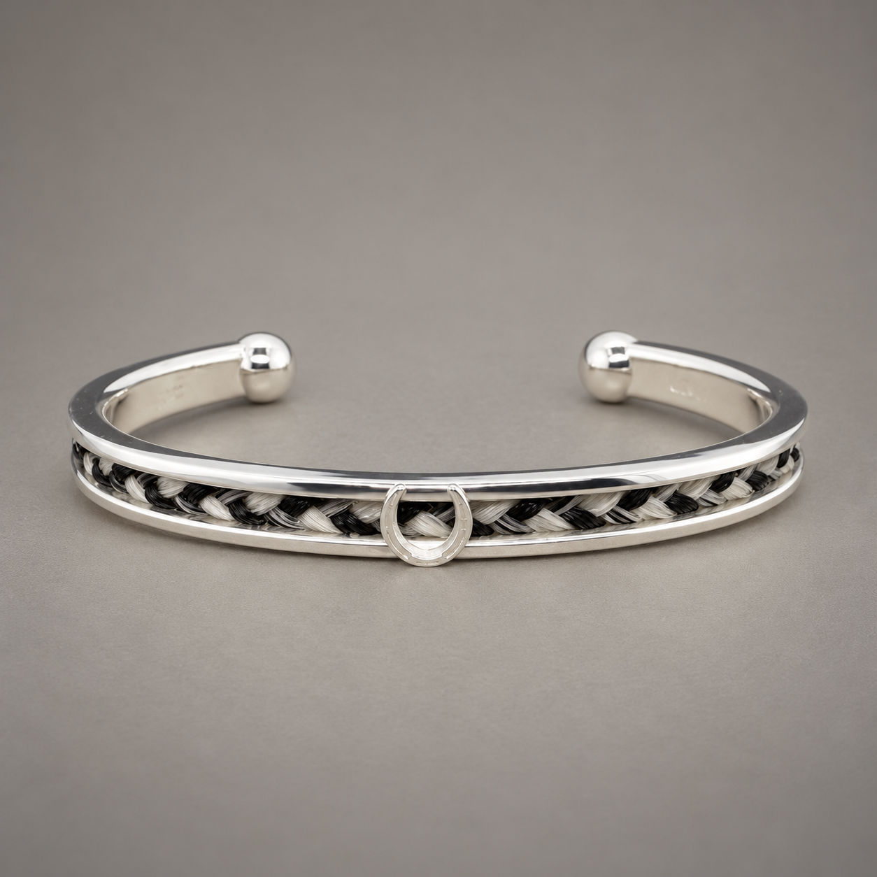 Polished Silver Braided Horseshoe Cuff.png