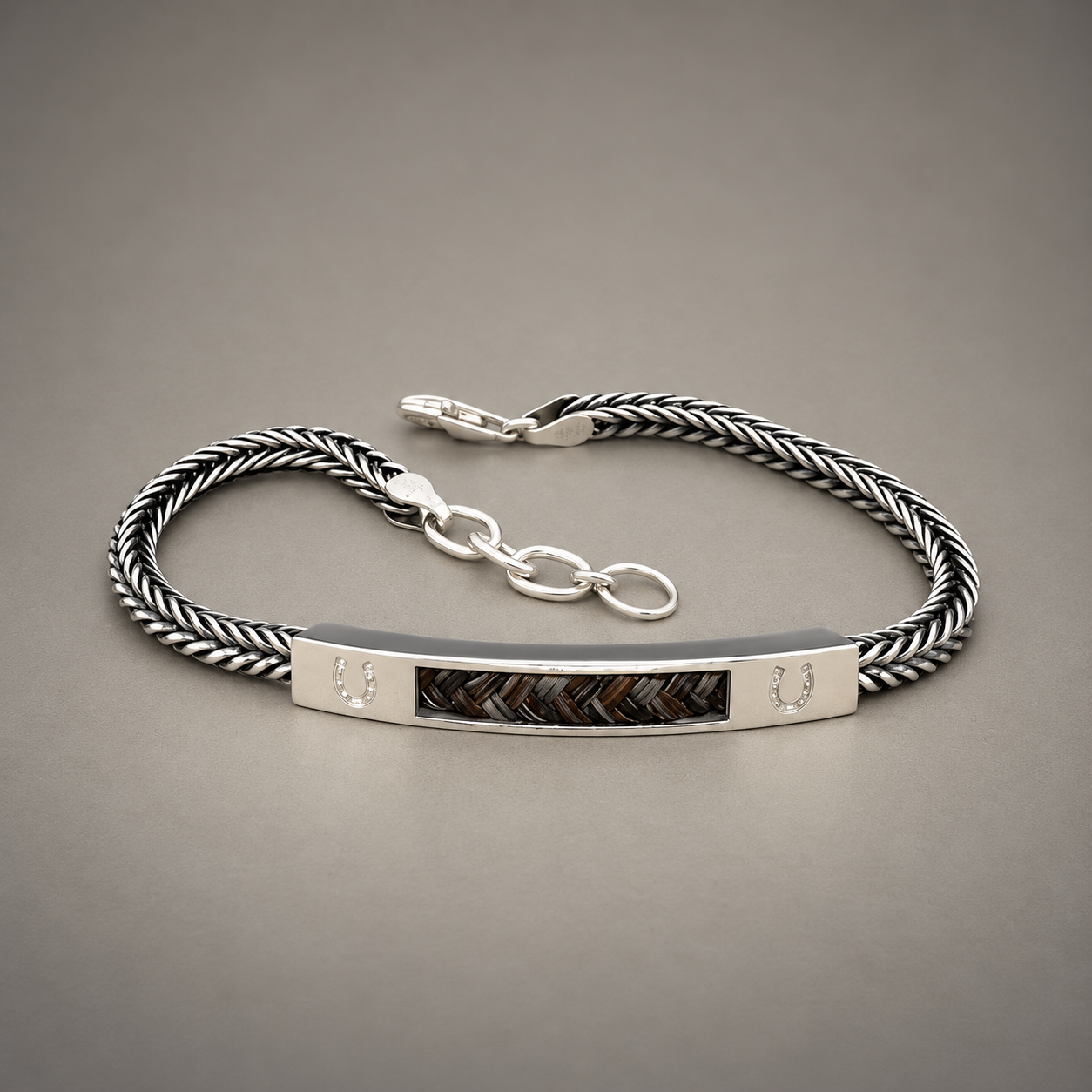 Braided Silver Bracelet with Horseshoe Details.png