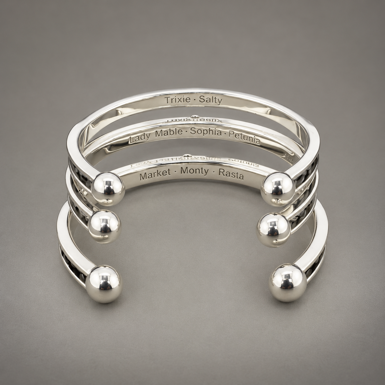 Engraved Silver Cuff Bracelet Stack.png