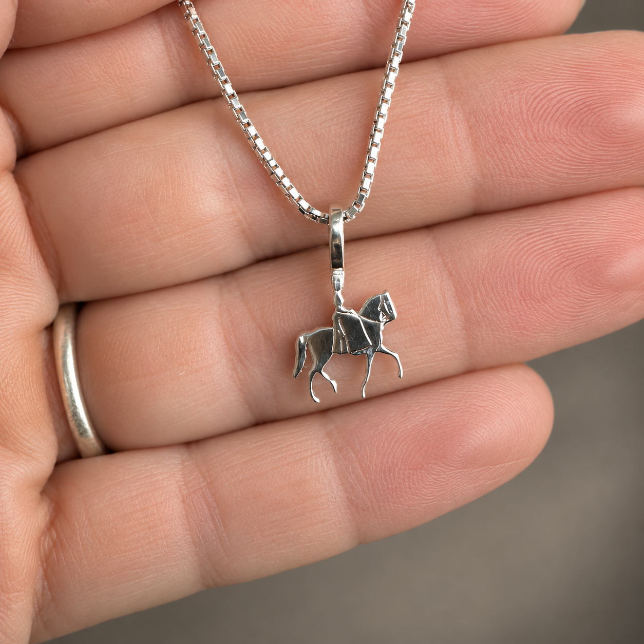 Silver Simple Bail Side Saddle Pendant in Hand.png