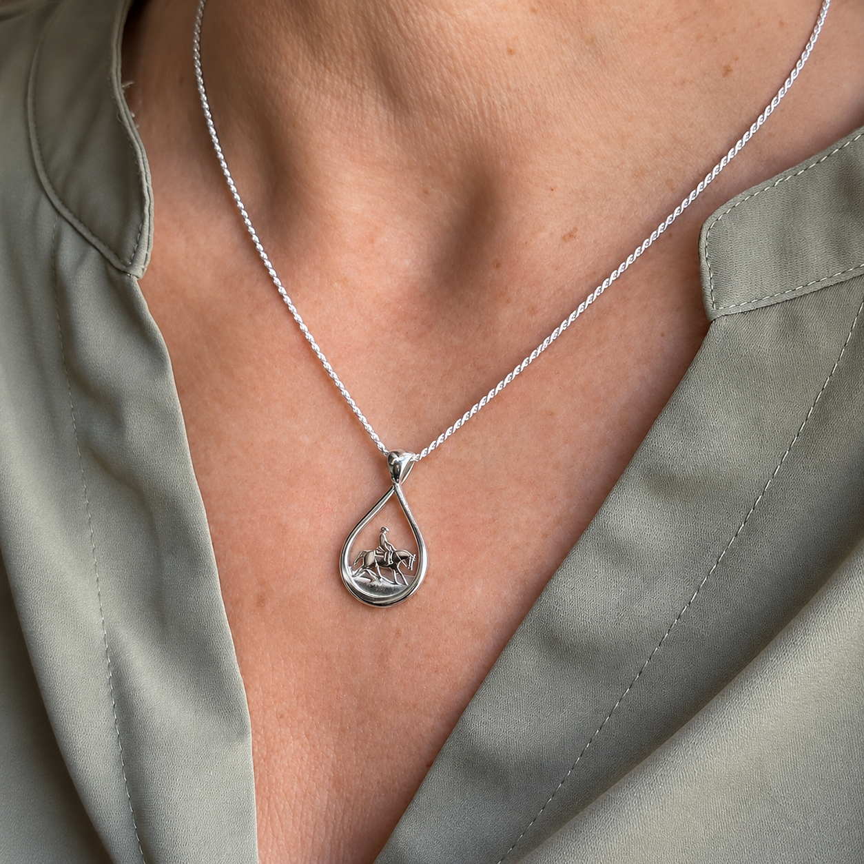 Silver Teardrop Reining Horse Pendant on model Sage Blouse.png