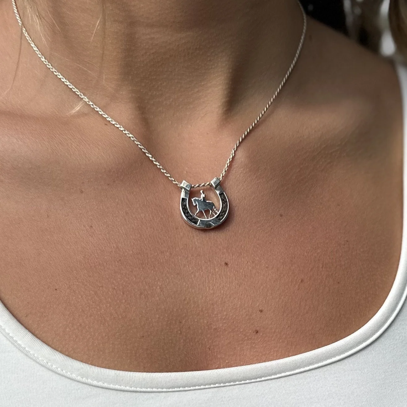 Abby- horseshoe with rider.jpeg