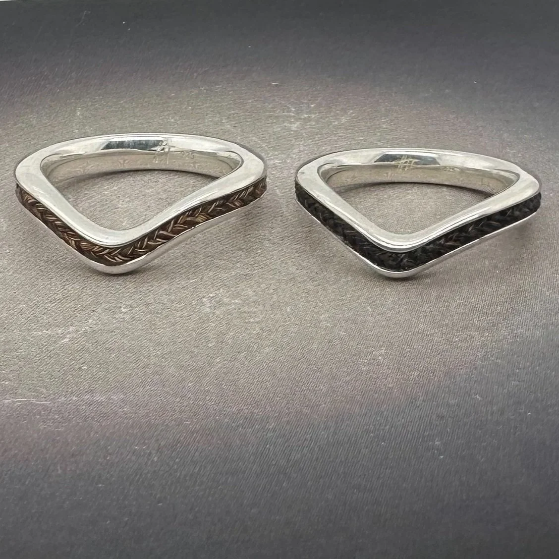 Color variation example of custom horsehair chevron rings in sterling silver.