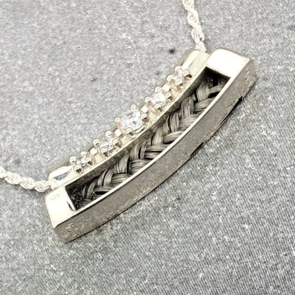 Alternate angle showing warm braid tones and sparkling stones catching the light.