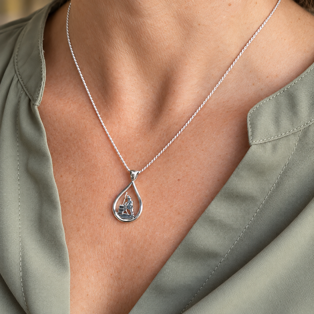 Silver Teardrop Working Eq Teardrop Pendant on Sage Green.png