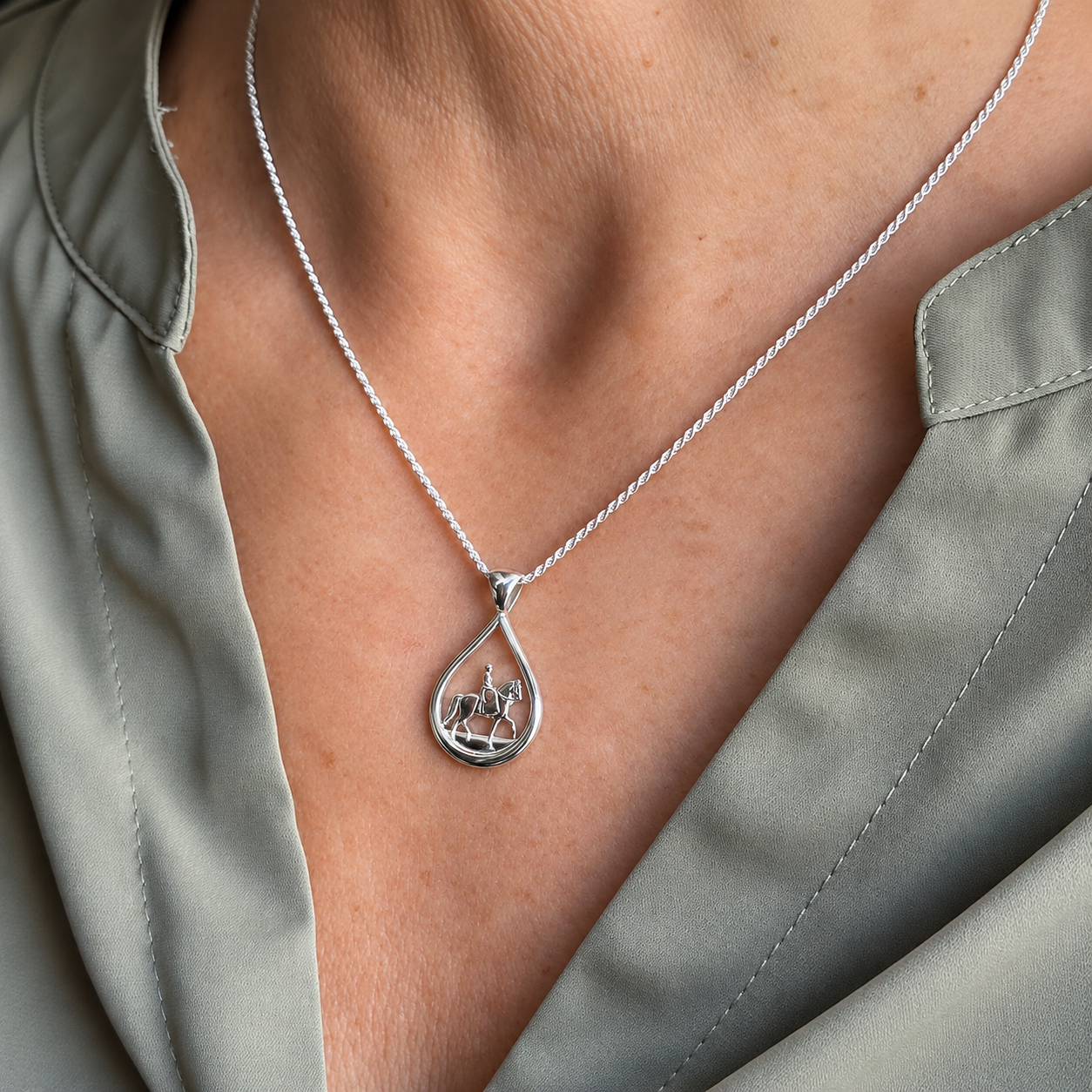 Silver Teardrop Side Saddle Pendant on model Sage Blouse.png