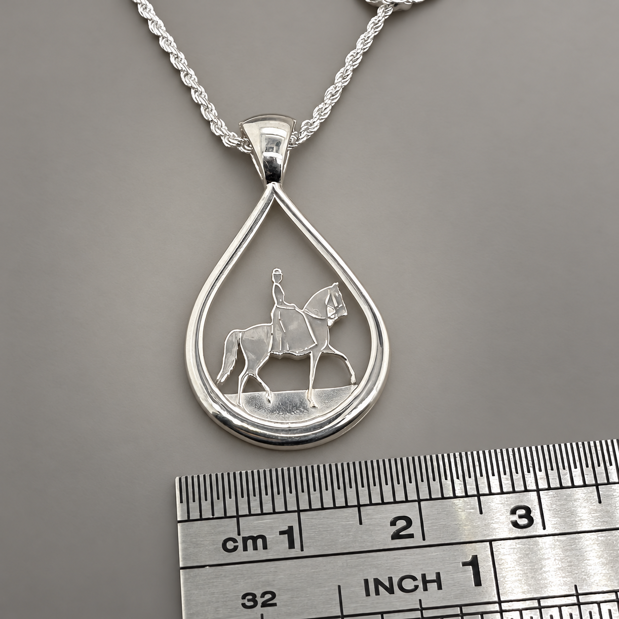 Silver Teardrop side saddlehorse with ruler pendant and ruler.png