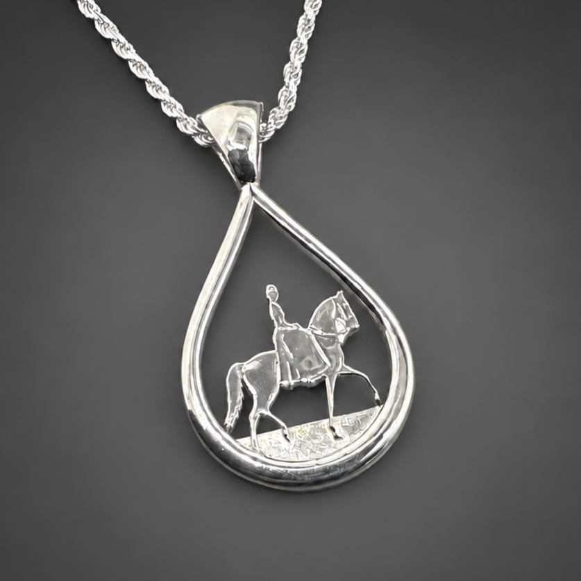 Silver+teardrop+side+saddle+close+uphorse+pendant+on+charcoal+gray+backdrop.png