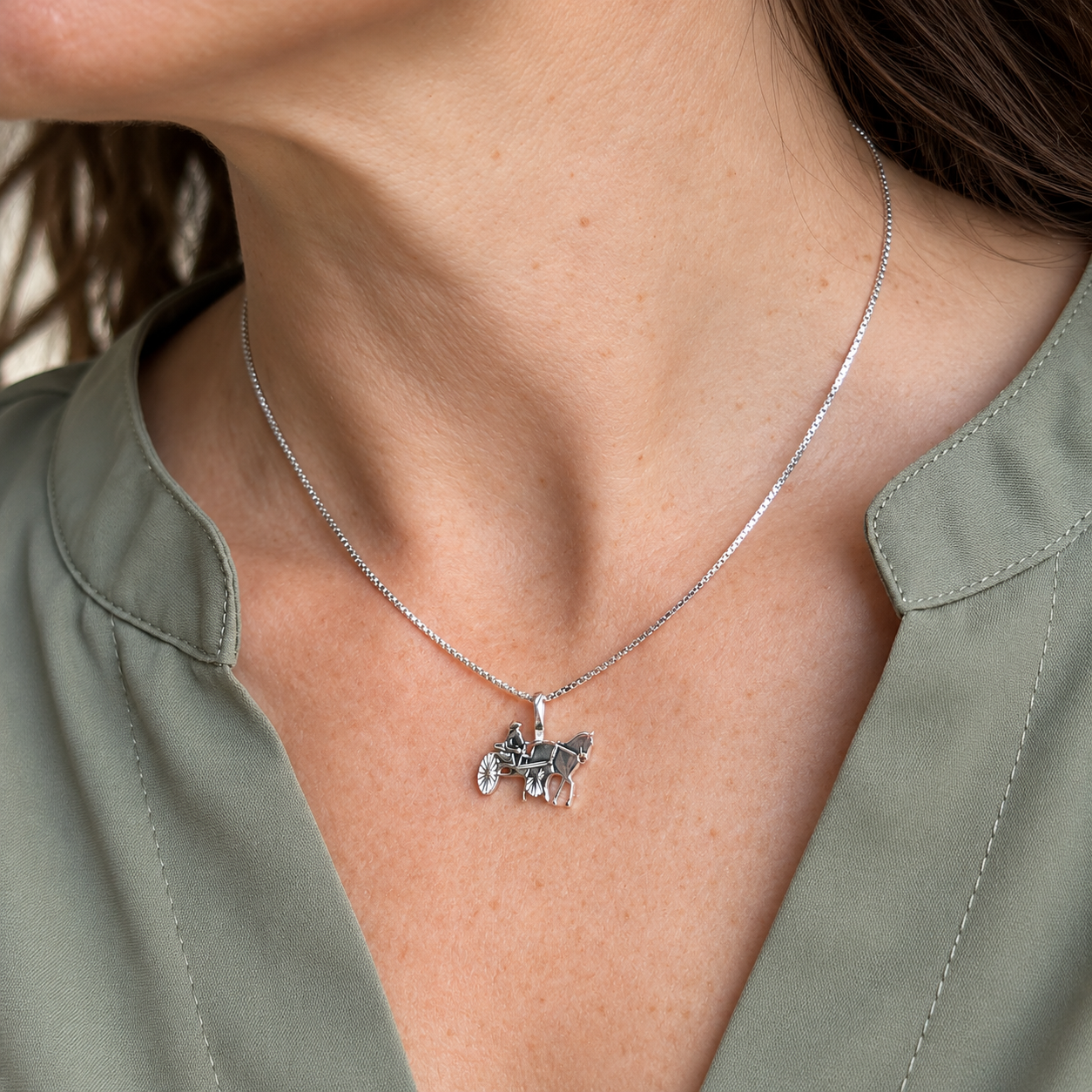 Silver Simple Bail Carriage Pendant on Model with Olive Blouse.png
