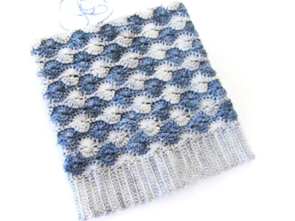 Hat front view laid flat prior to gathering.