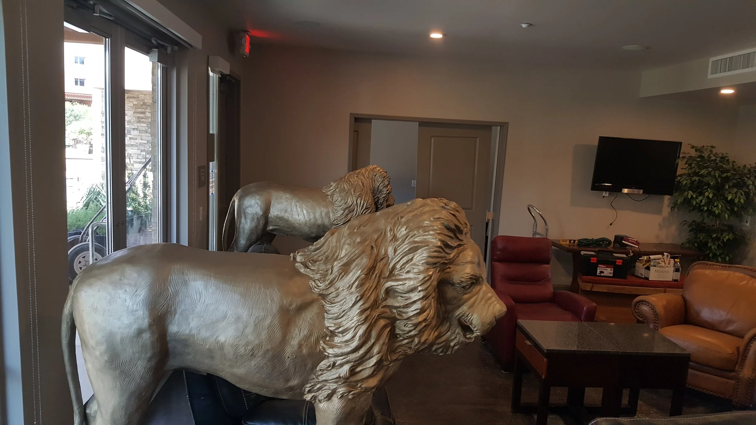 The bronze 6” lions guard the entrance