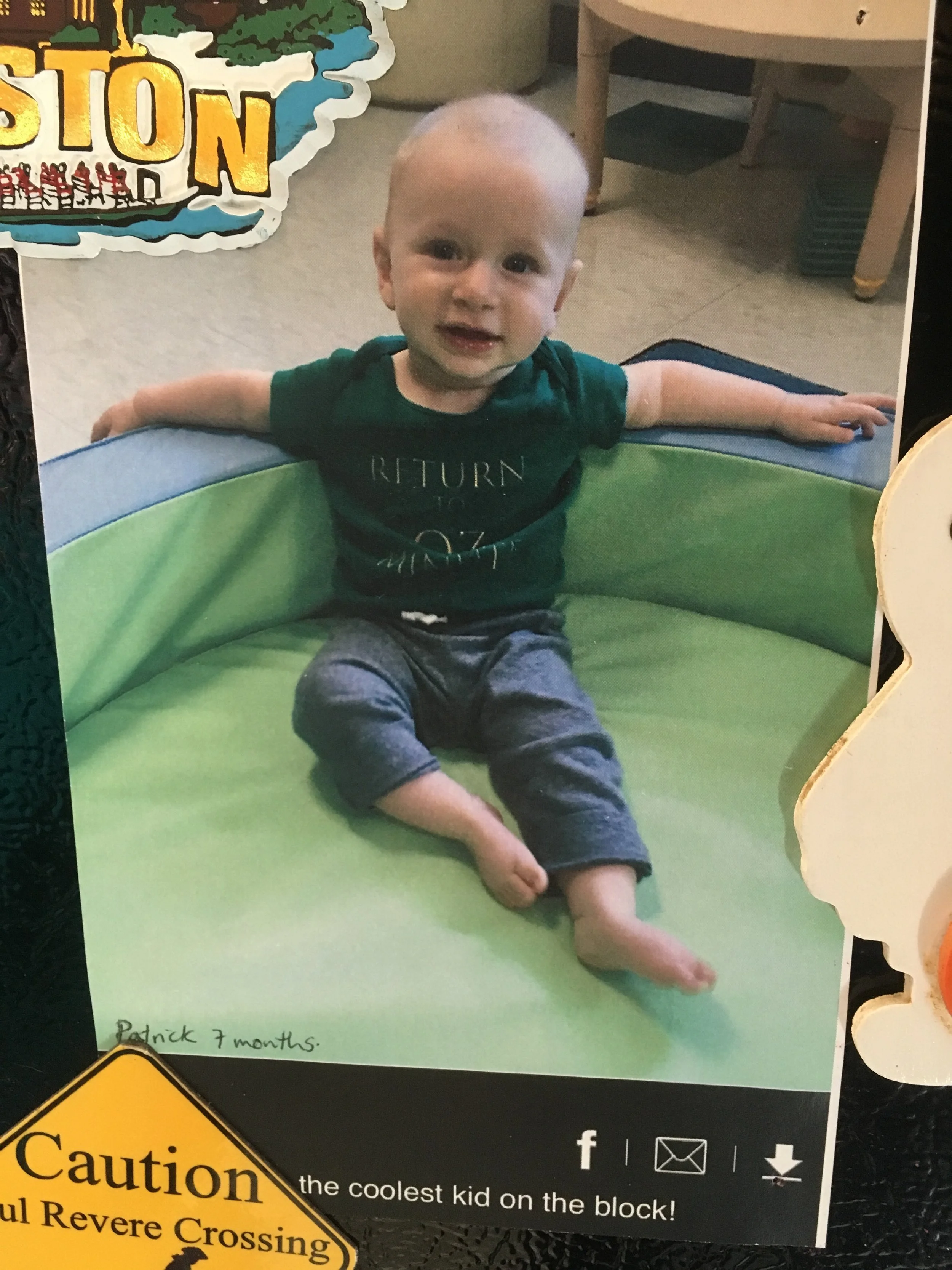  The “silent cohost” of Return to Oz Minute and The NeverEnding Minute shows off some podcast merch at his daycare, 2018 