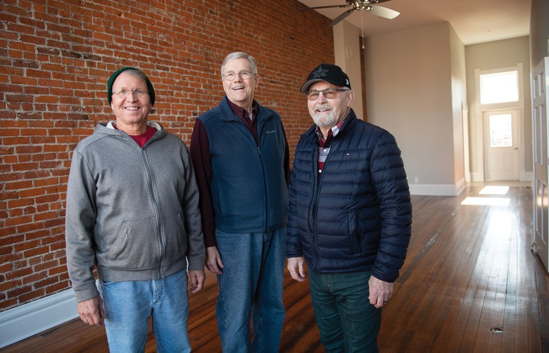   From left are Craig Pfantz, State Center’s mayor; Harlan Quick, a City Council member; and Doug Riley, who is active with the State Center Development Association. The men are standing inside a building along Main Street that was recently renovated