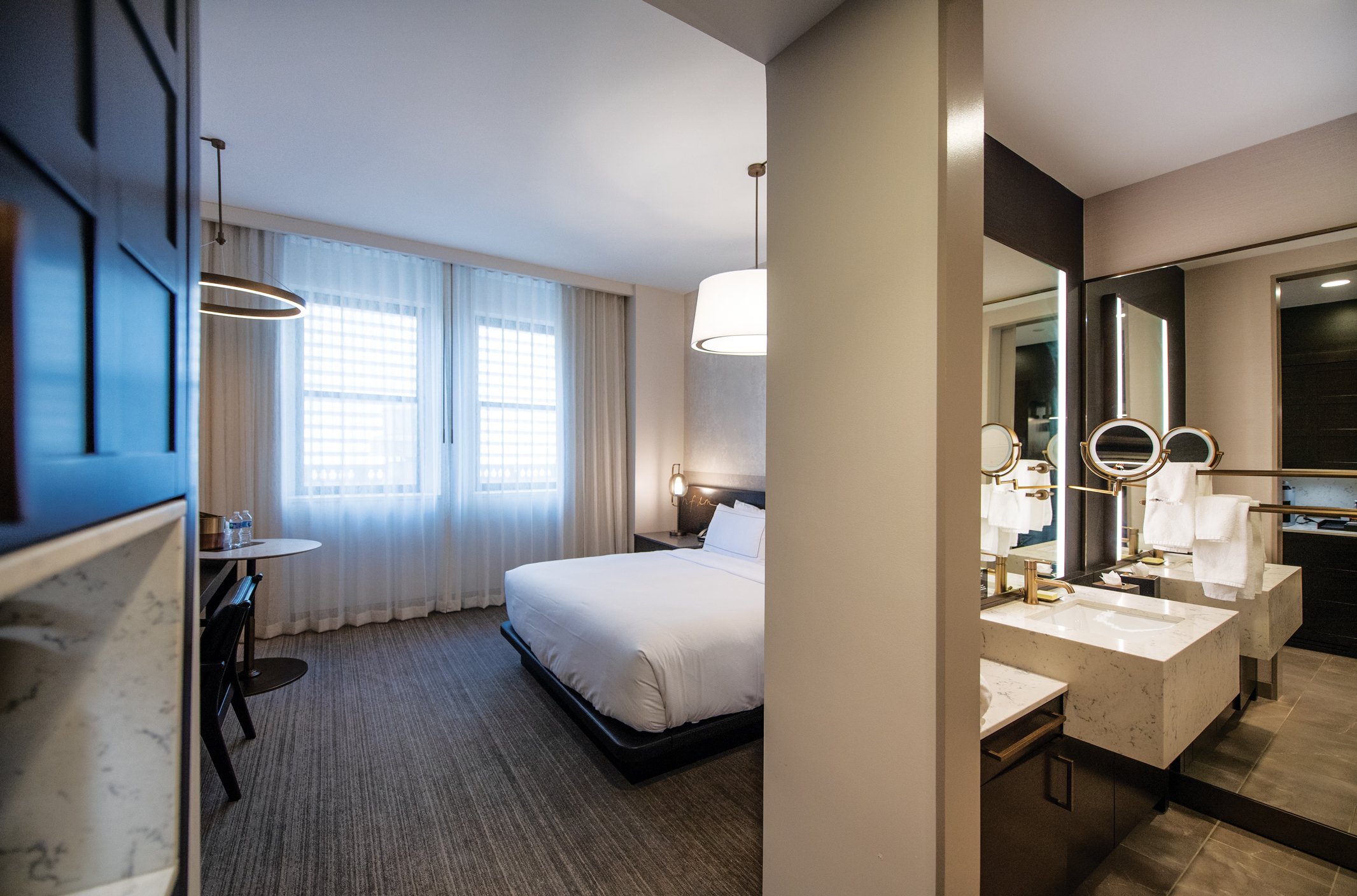 Careful decisions were made on the details inside the guest rooms, including 3D-printed wallpaper that gives the illusion of a thin rope being on the wall and light switches that match the historic feel of the building.