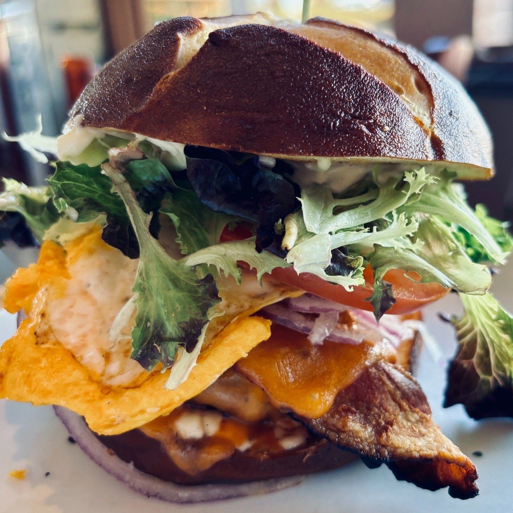 Have you tried the NEW TC's House Burger? It comes with your choice of FRESH homemade soup or fries and is served on a pretzel bun with lettuce, tomato, cheese, bacon + trailer sauce. YUM! 🤤
.
TC's Pub is OPEN for lunch and dinner weekdays from noon
