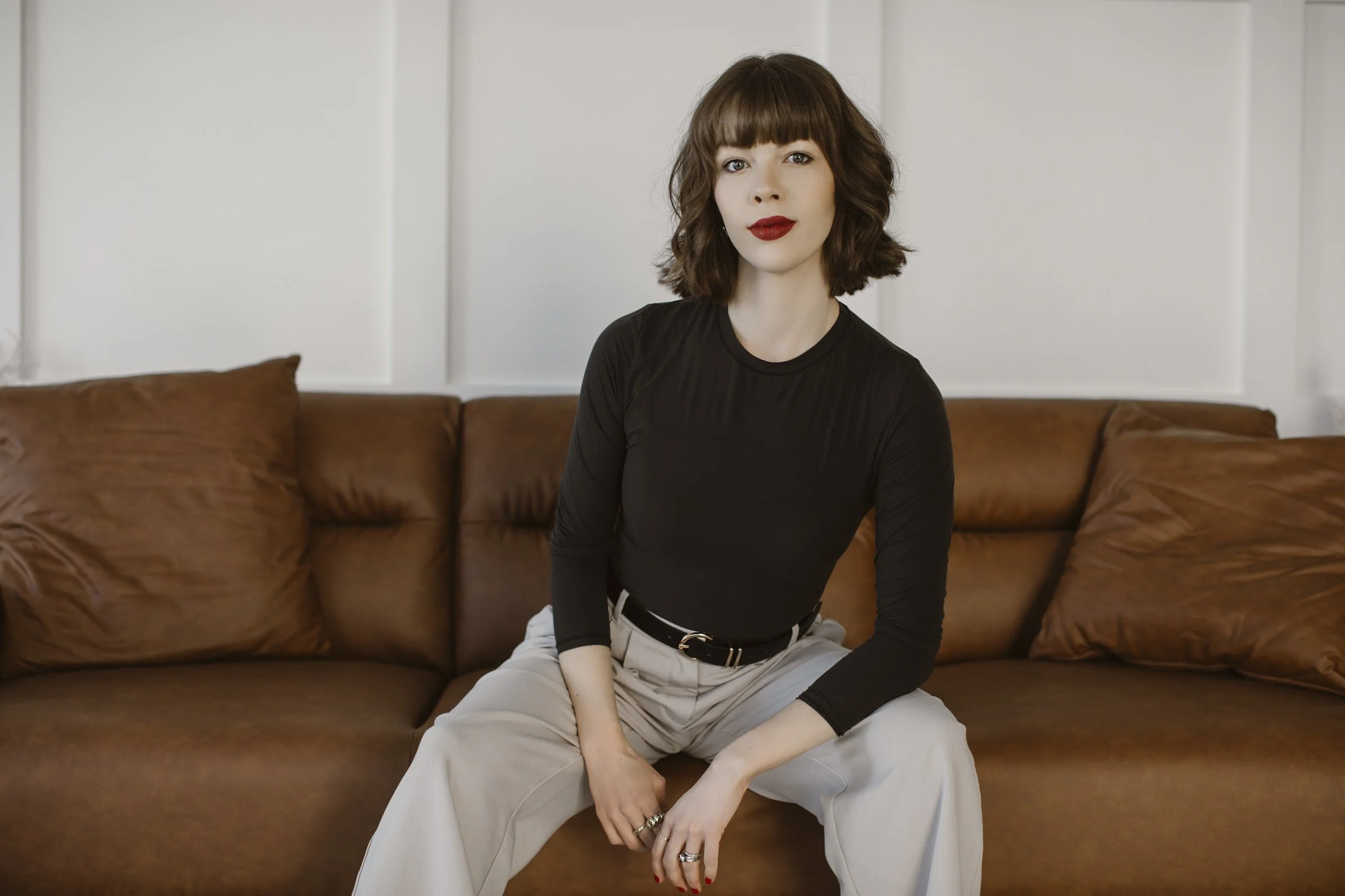 Shyanne Reynolds sitting on a couch.