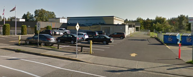 Street view of school and parking lot.
