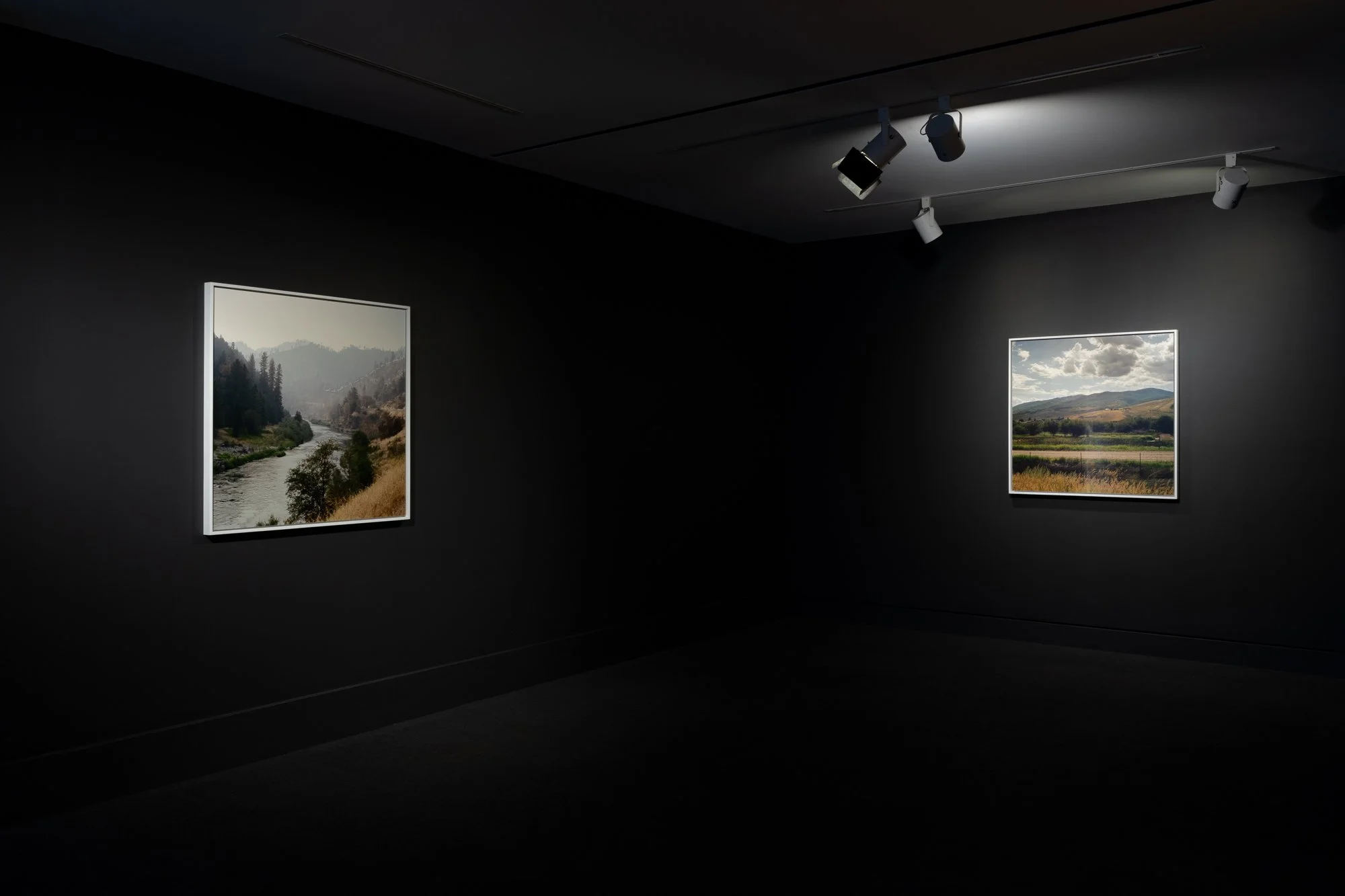 two framed photos in a gallery