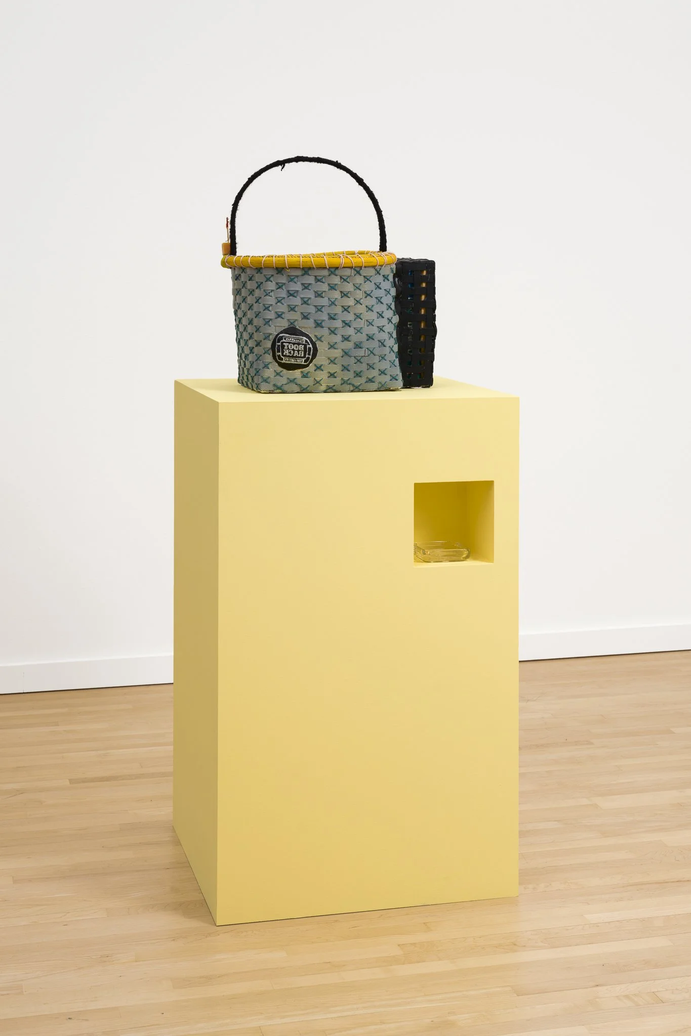 a basket on a yellow podium