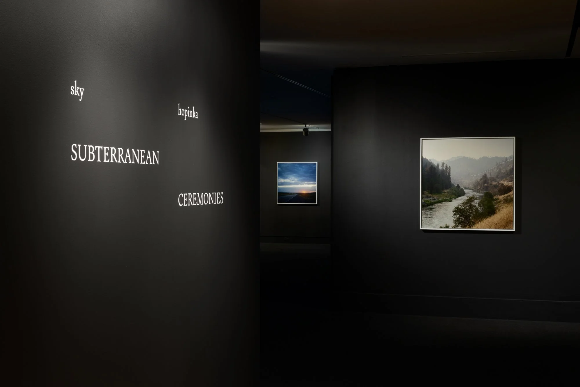 two framed photos in a gallery