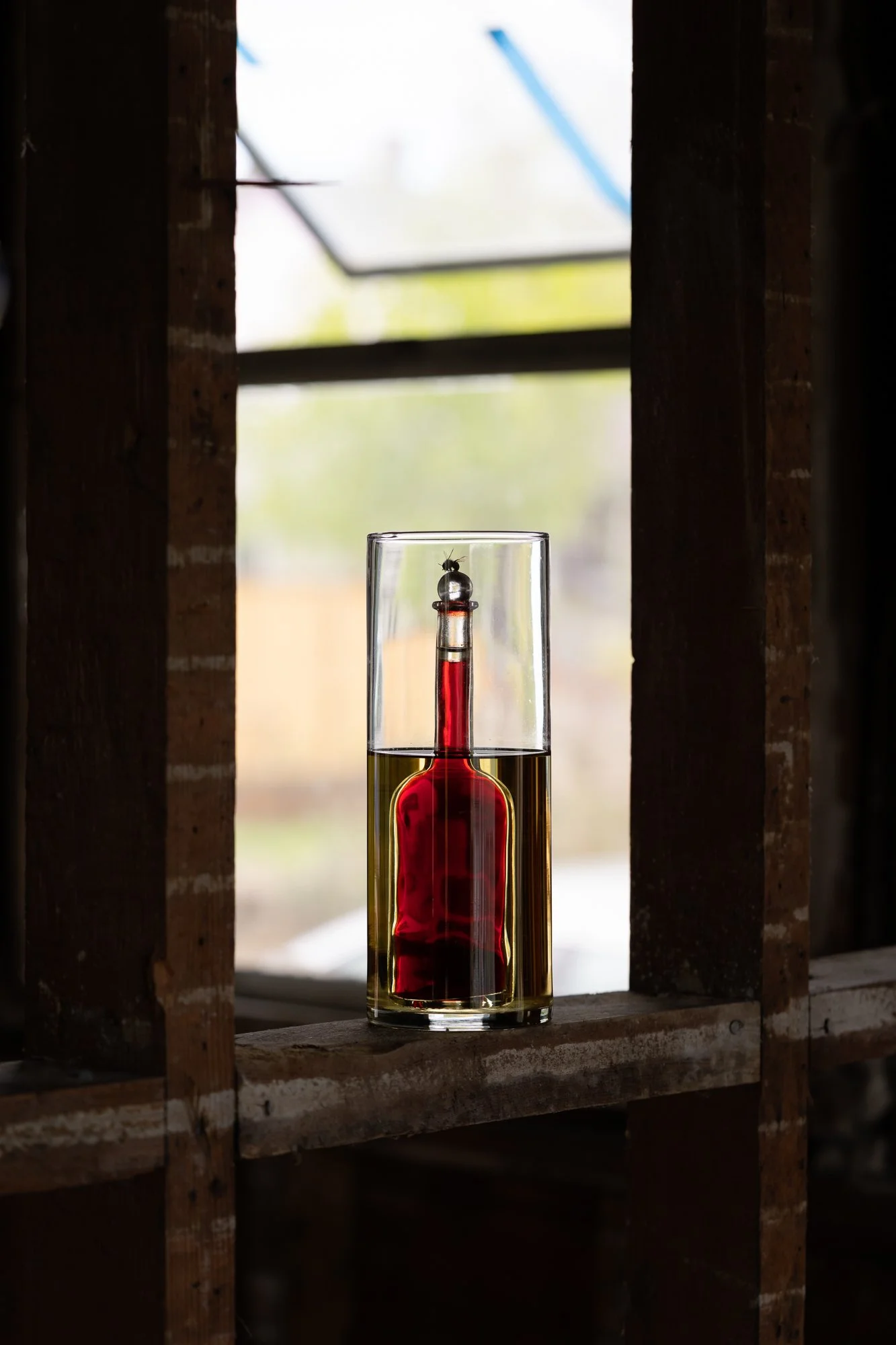 a sculpture made of glass vessels and colorful liquids