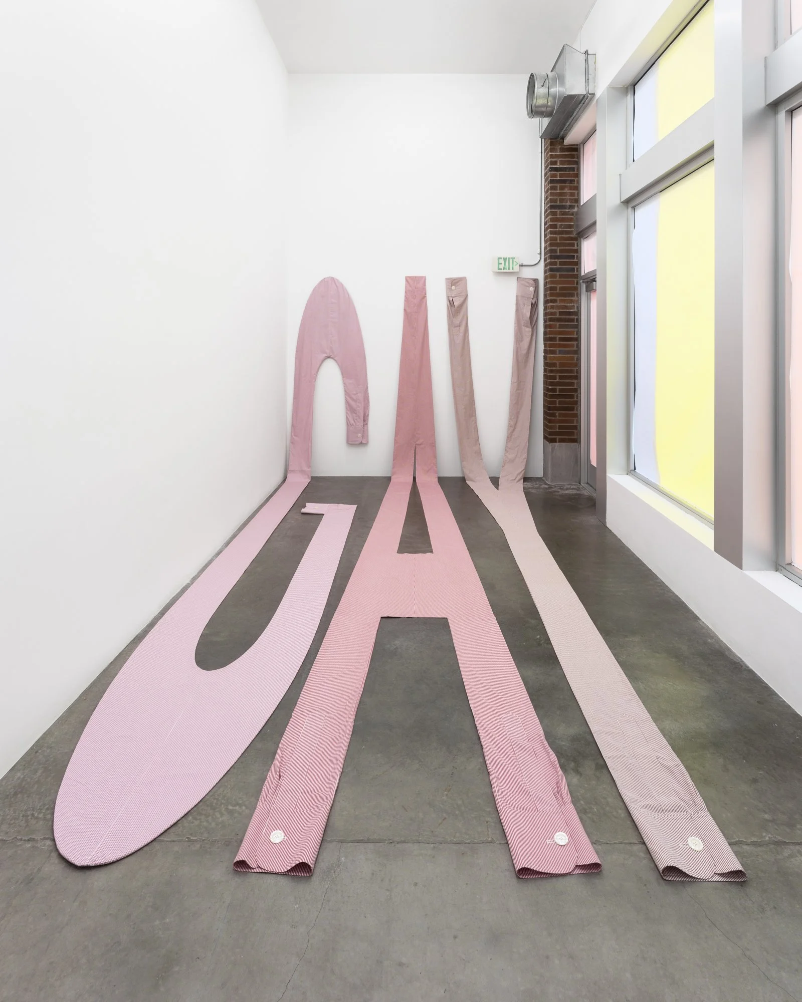 large textile sculpture in the shape of letters G, A and Y