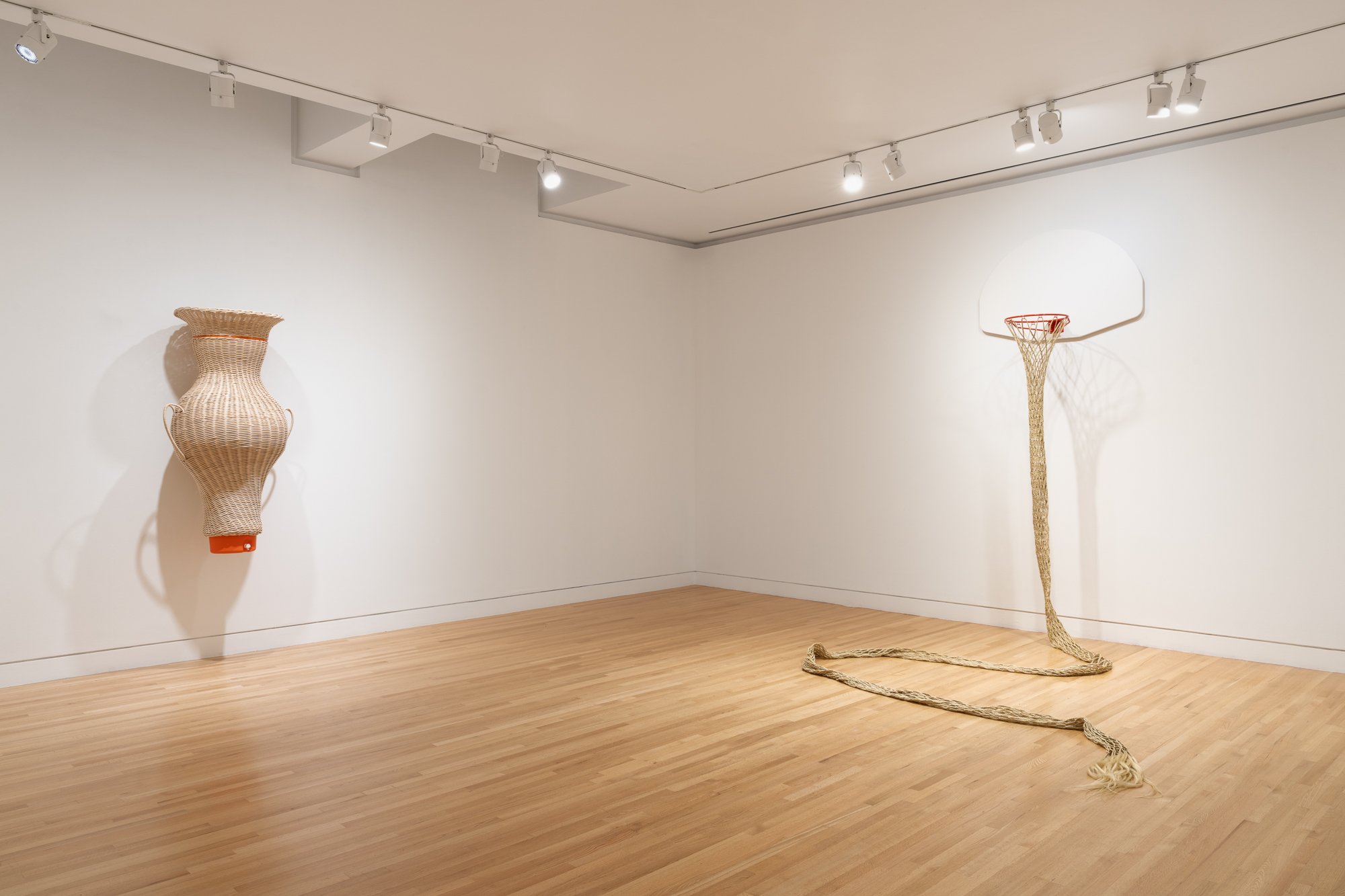 a large basket on the left; a basketball hoop on the right