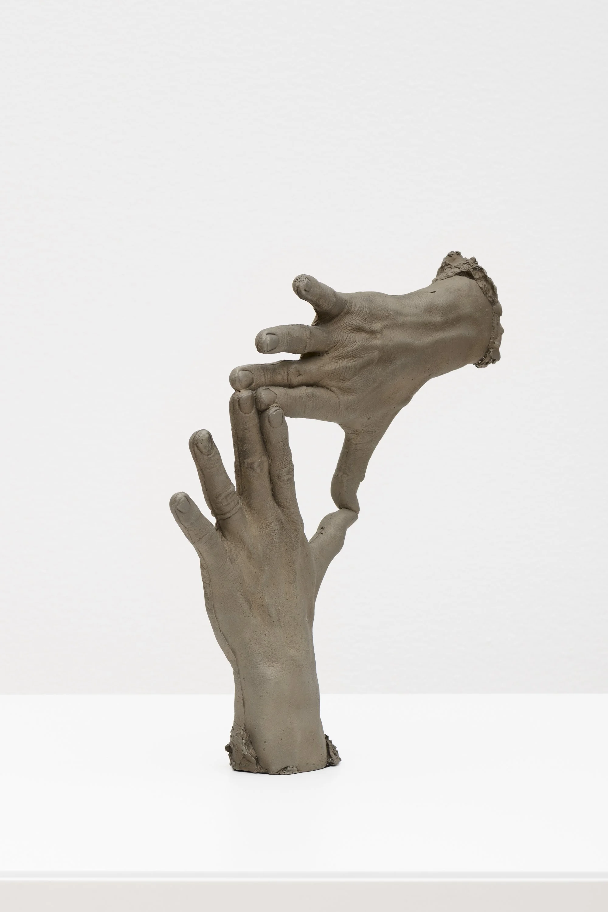 bronze sculpture of two hands
