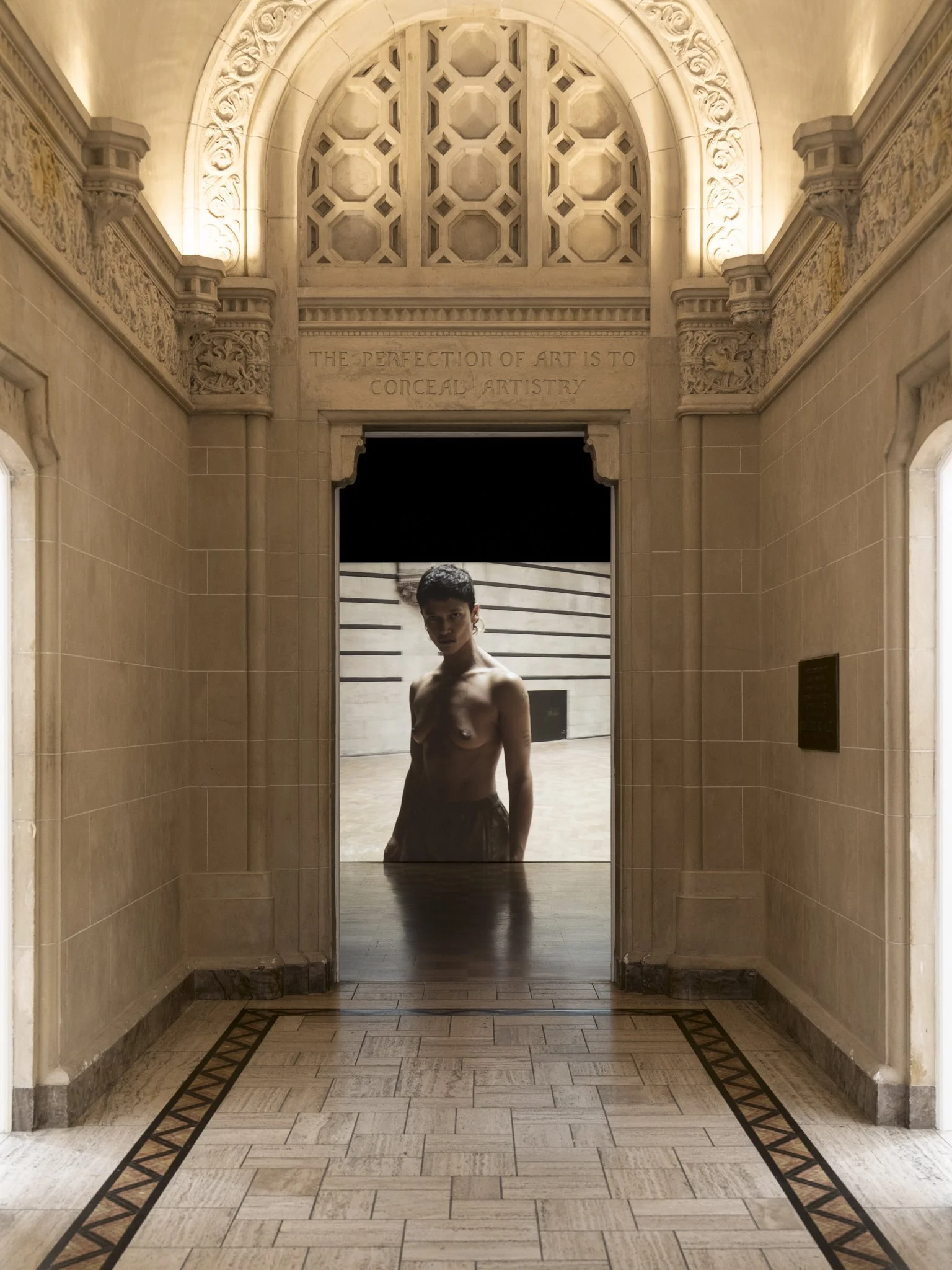 a video of a woman seen through a door