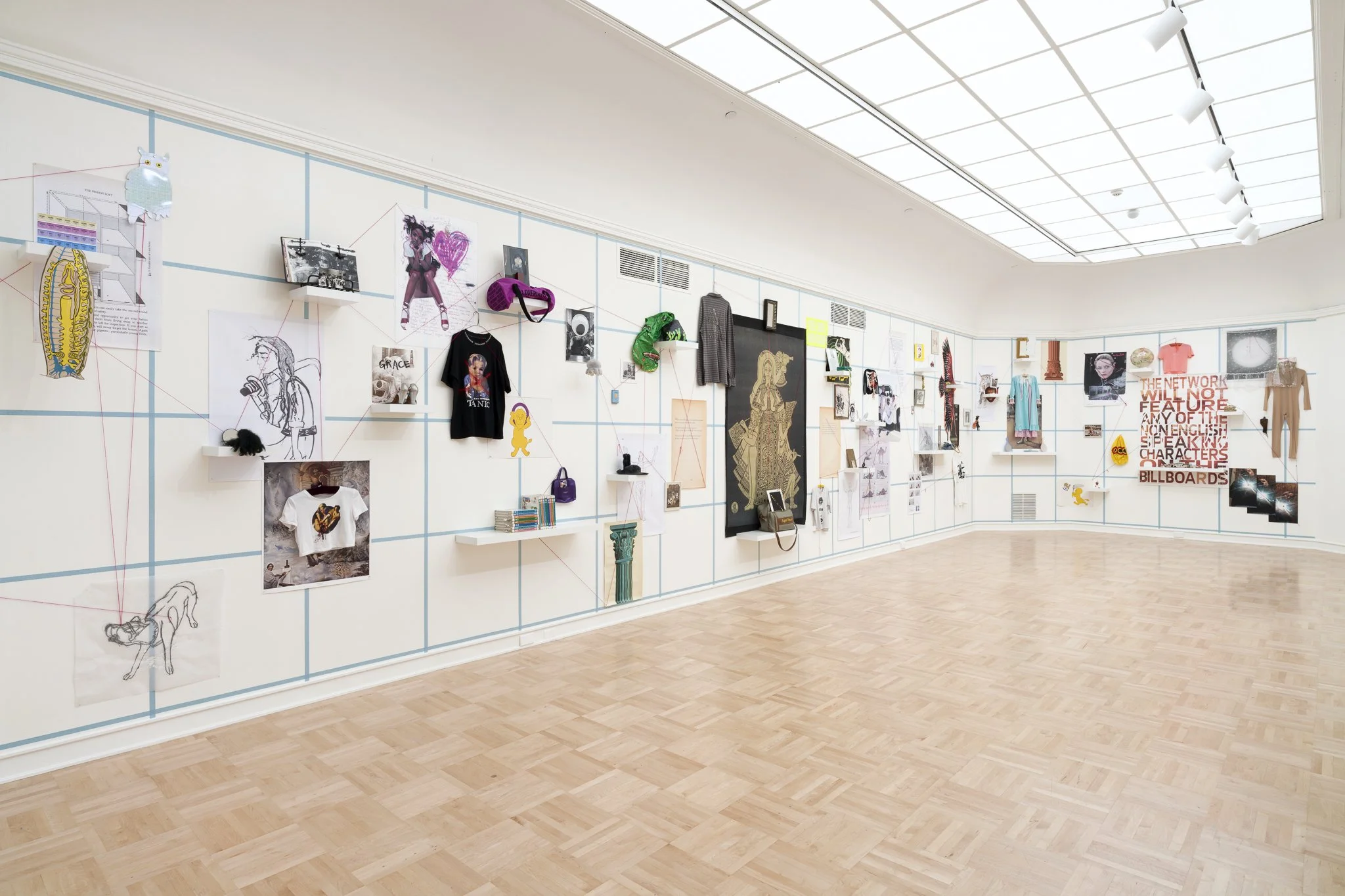 a large-scale wall collage in a gallery