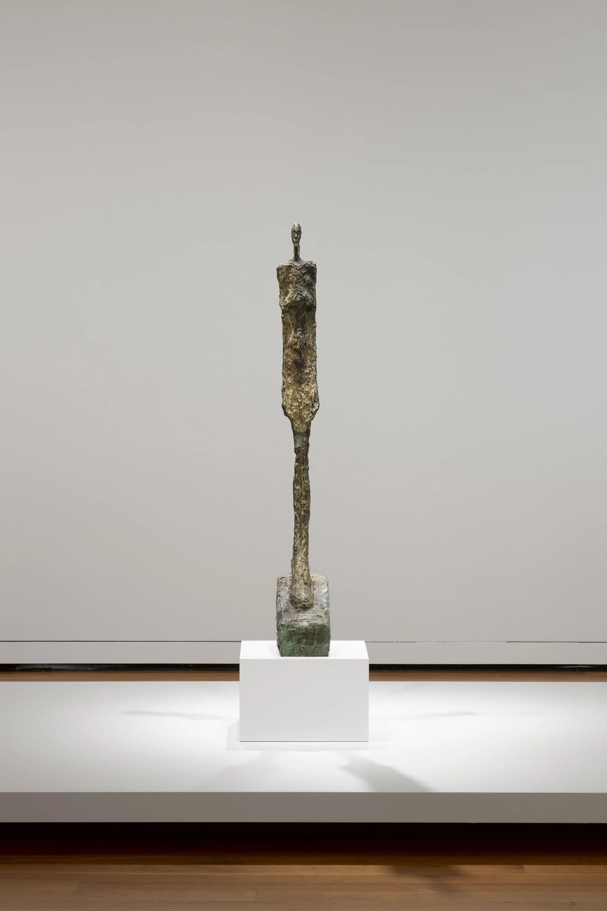 a metal sculpture of a figure