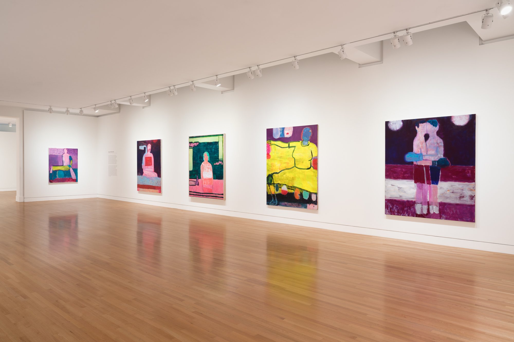 colorful paintings in a gallery