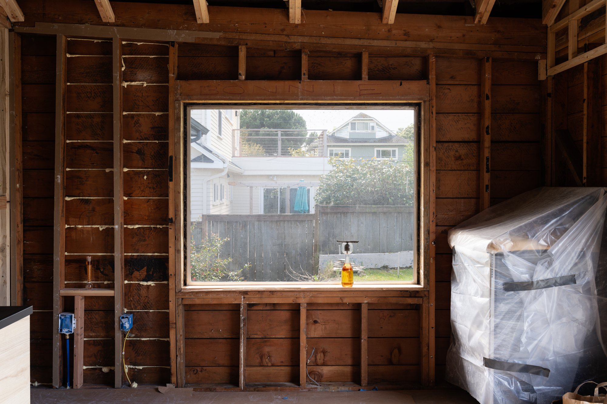 a glass vessels with liquids in an empty room under construction