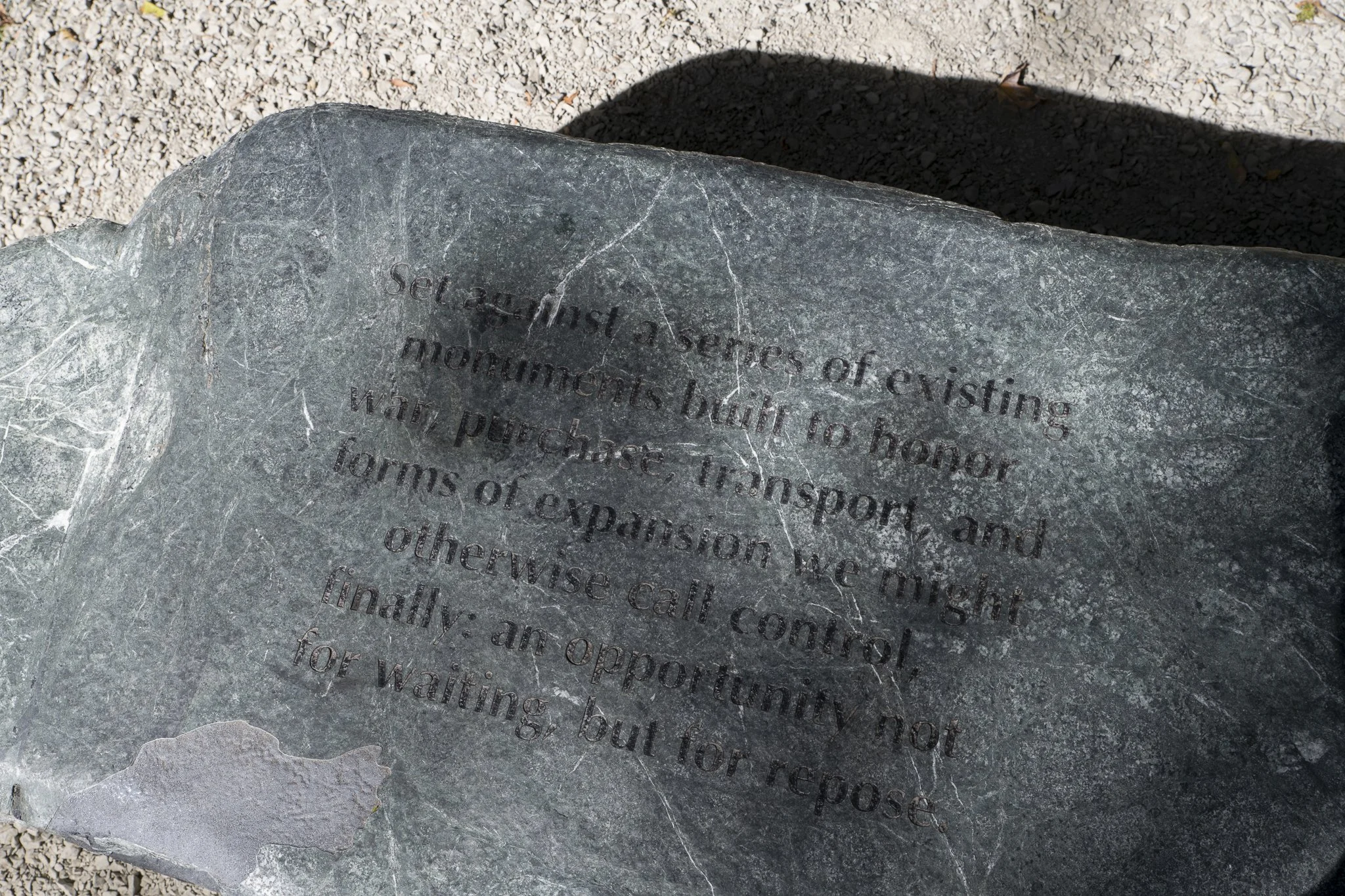a large rock with etchings of texts