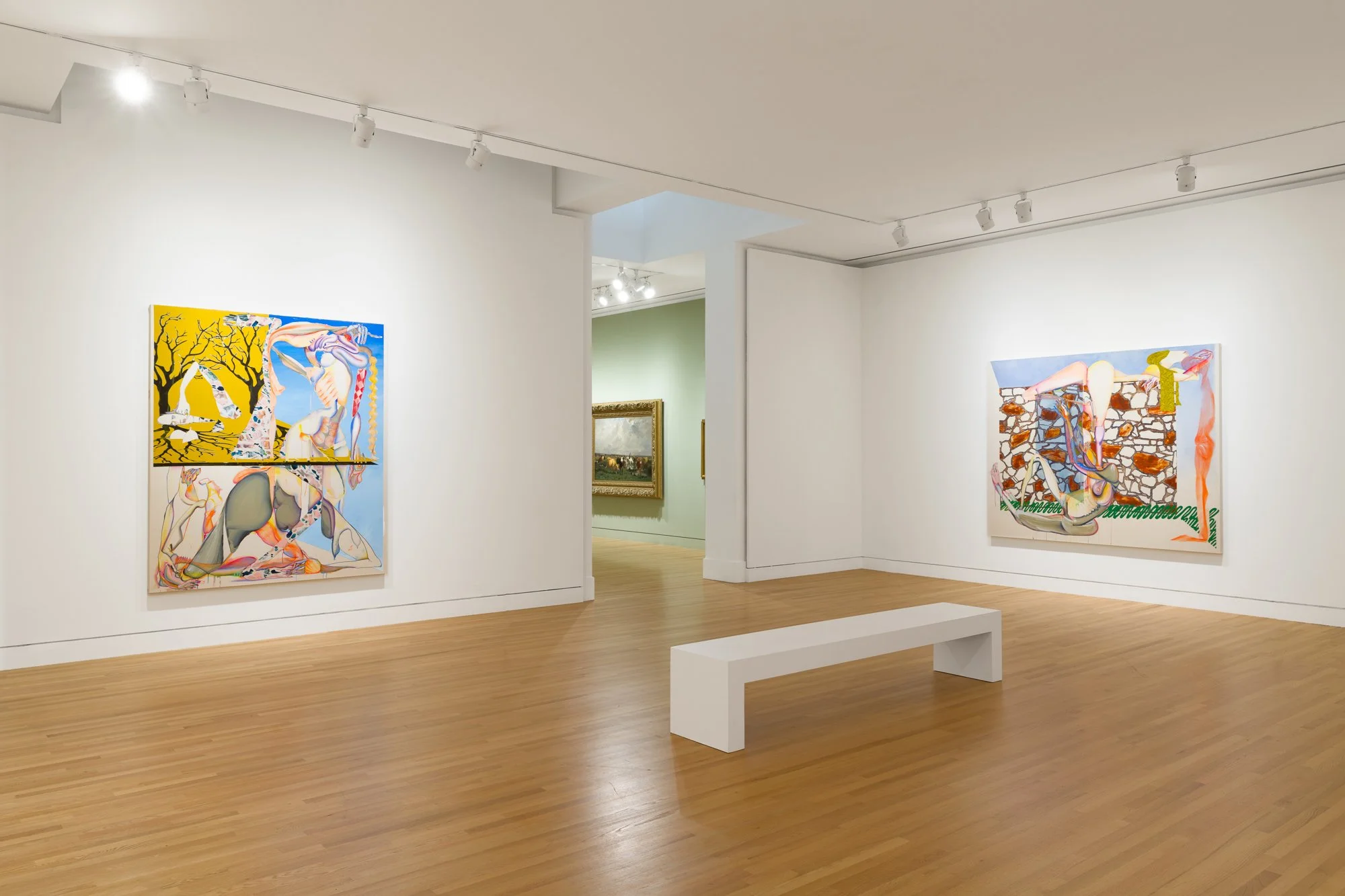 two abstract paintings in a gallery