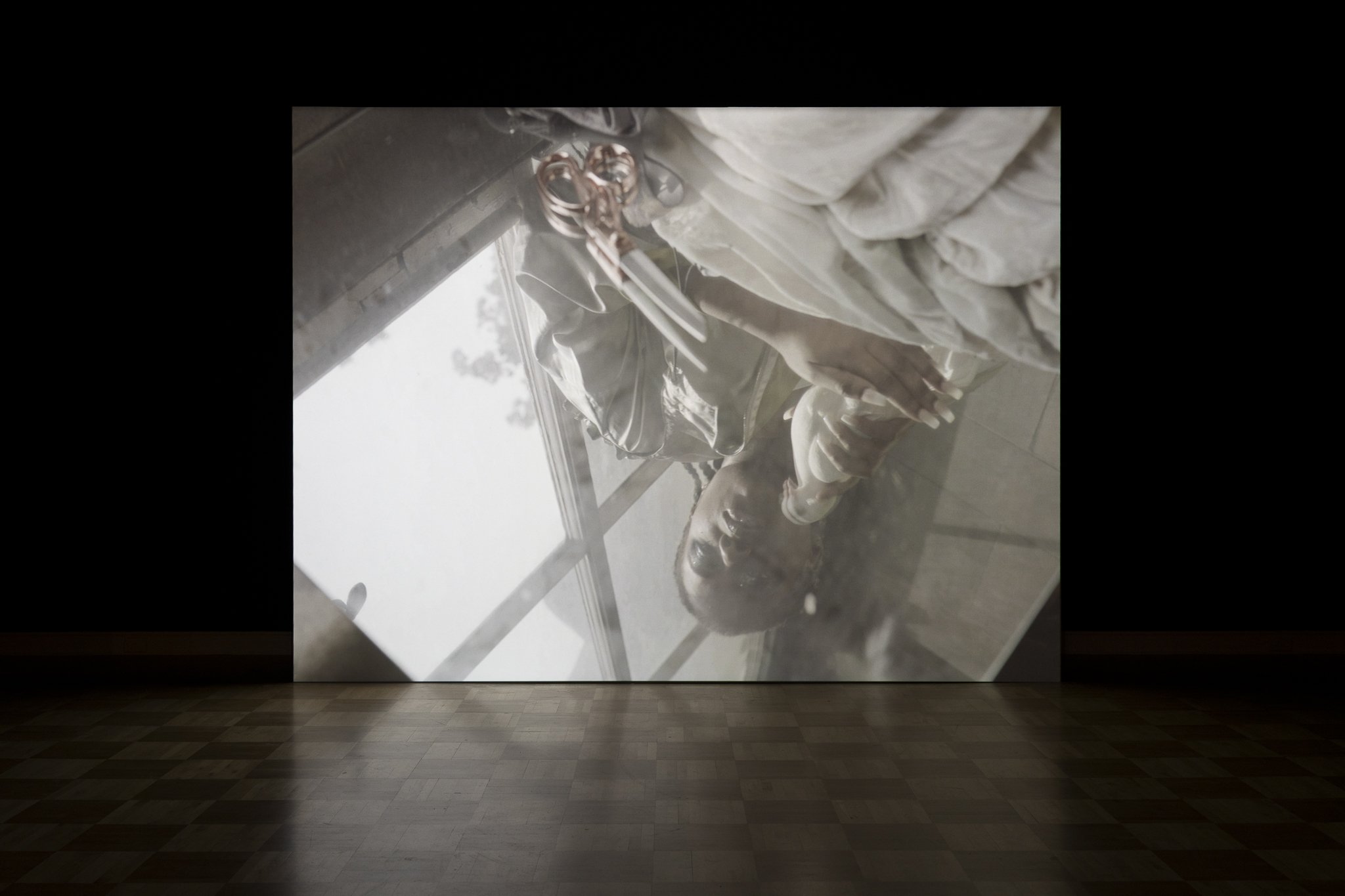 a projected video of a figure upside down
