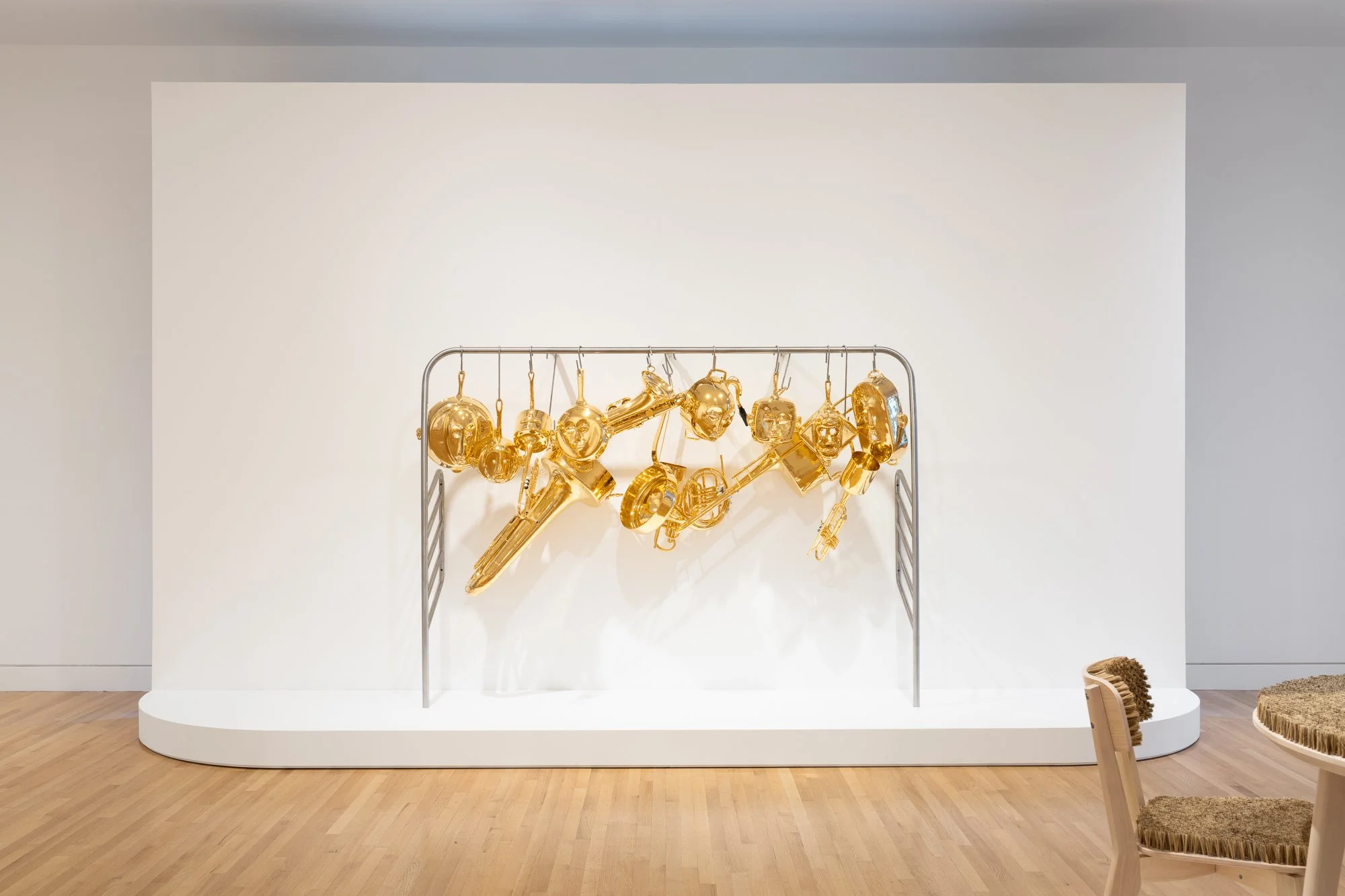 gold colored metal cookware on a rack